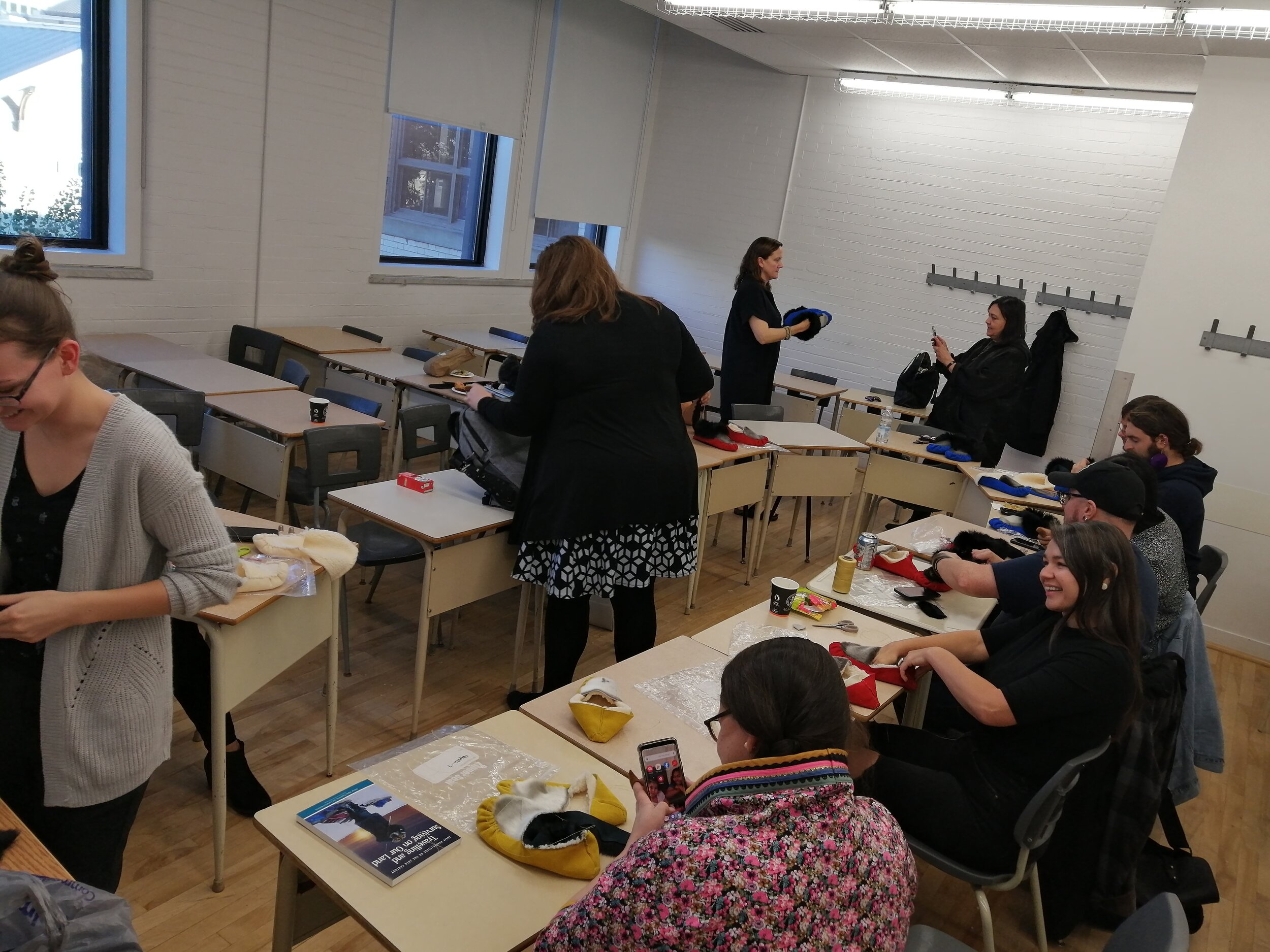  Participants in the Labrador Inuit Slipper Making Workshop, led by Veronica Flowers and Vanessa Flowers, at the 21st Inuit Studies Conference, UQAM, Montreal QC, October 2019. Photo courtesy of Heather Igloliorte. 