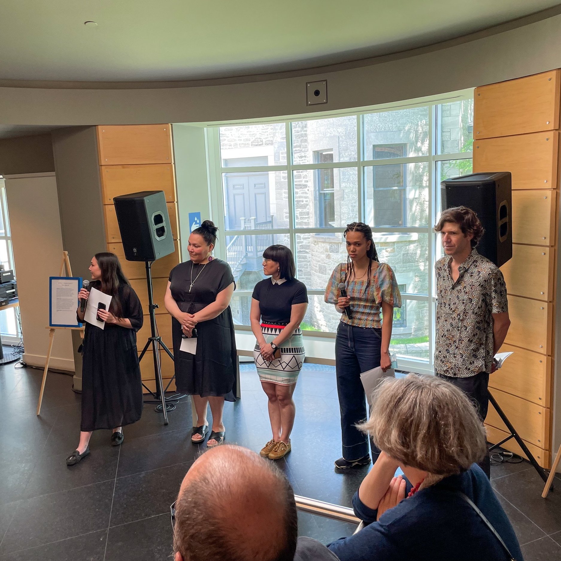  Members of the curatorial team welcome visitors to the exhibition opening of  ᐊᖏᕐᕋᒧᑦ / Ruovttu Guvlui /Vers chez soi / Towards Home , Canadian Centre for Architecture, Montreal, QC, June 11, 2022. Photo by Maggie Hinbest. L to R: Nicole Luke, Taqral