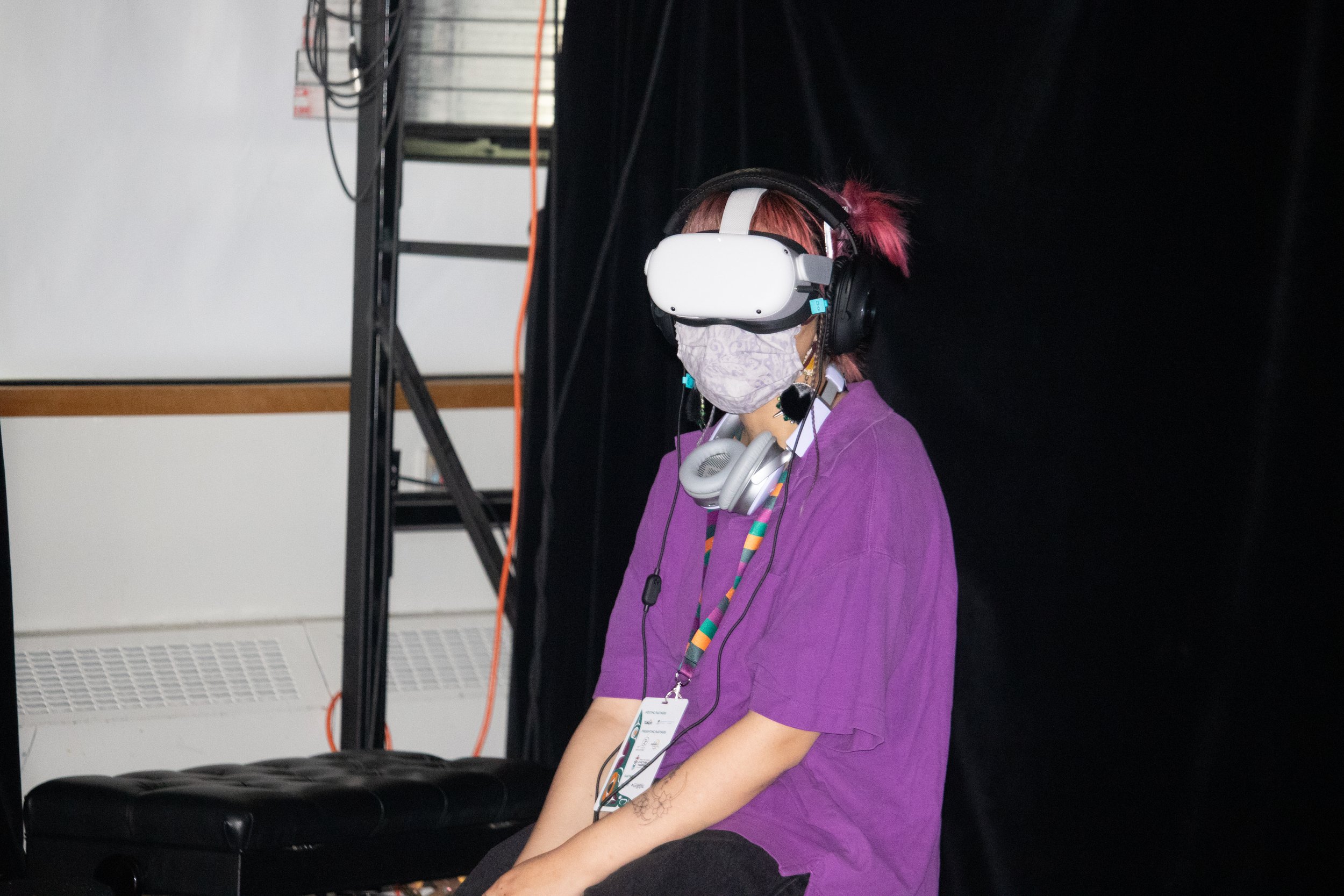 Ilinniaqtuk, Siku Rojas, uses a VR headset to watch ARCTIC XR at the Arctic Arts Summit, Whitehorse, Yukon, 2022. 