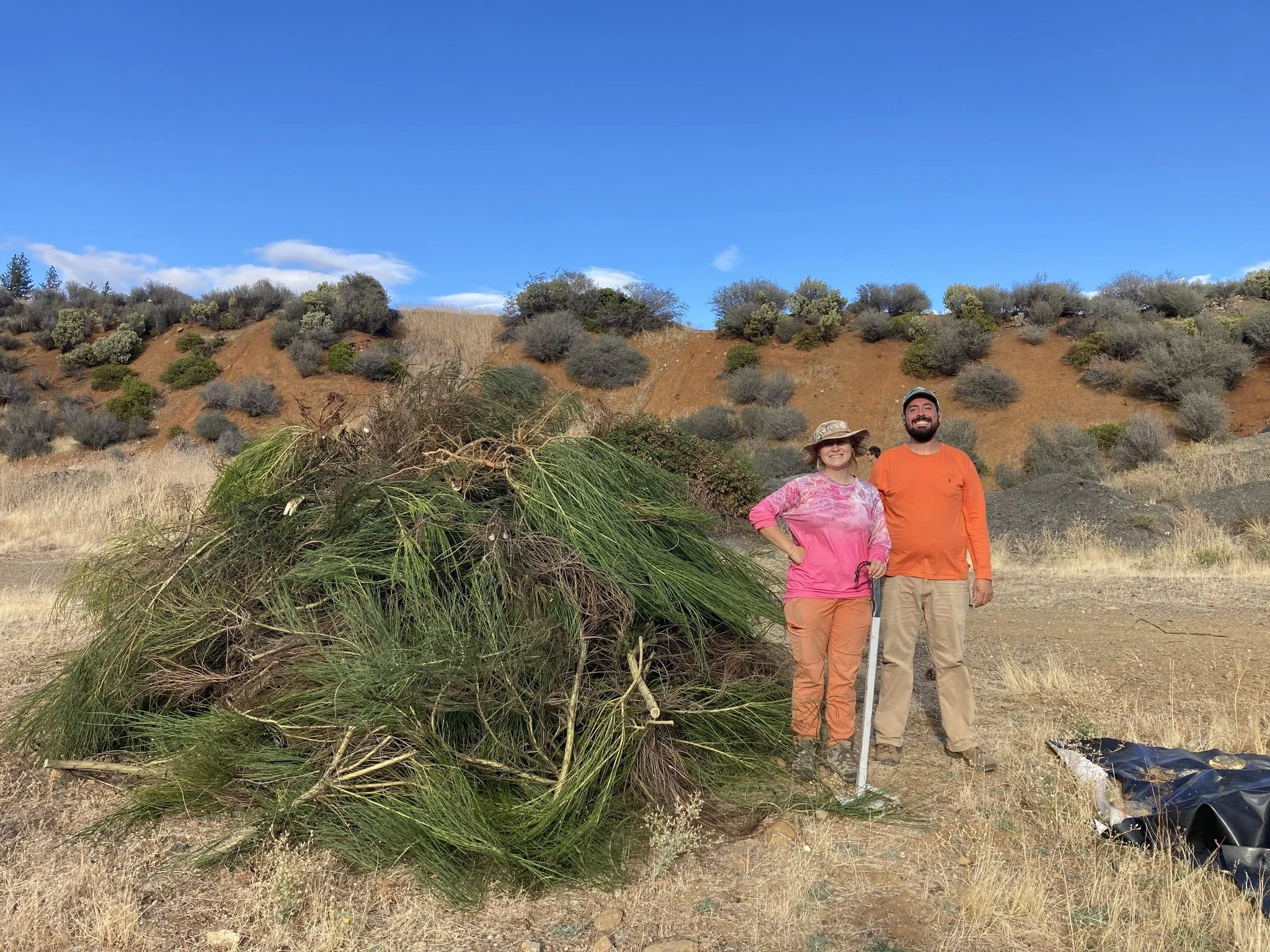 Lane and Andre Next to Pulled Scotch Broom Pile.jpg