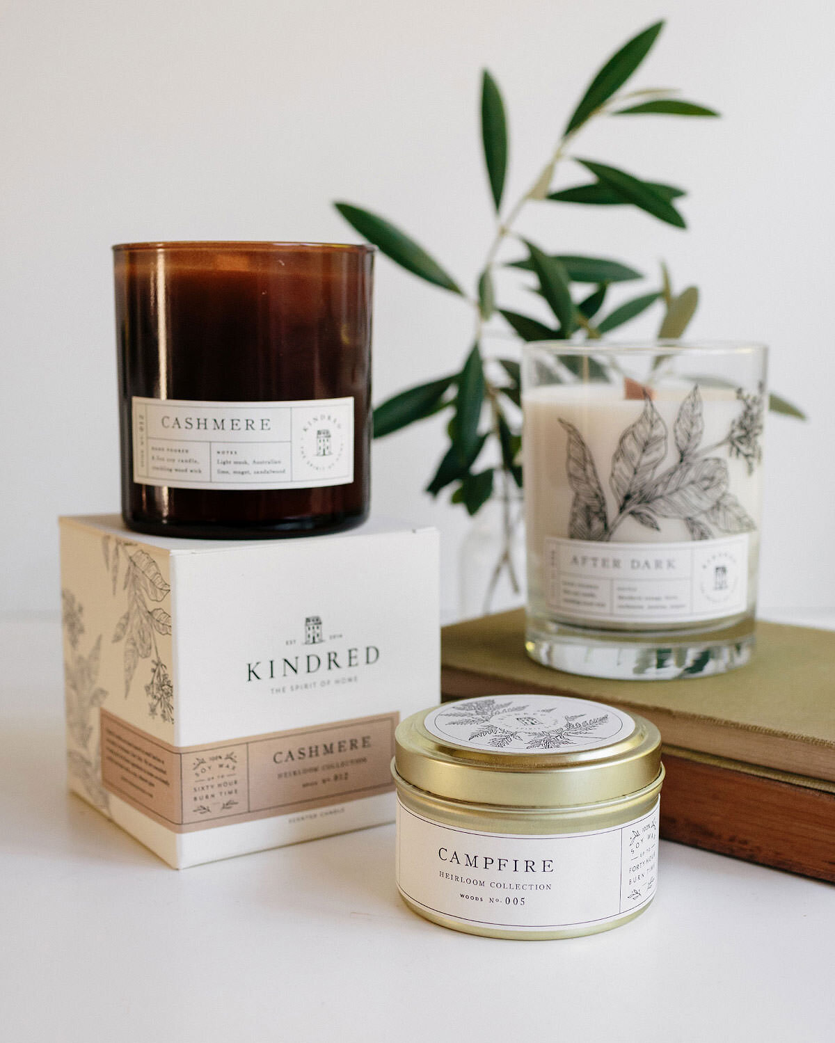 candle jar and box packaging featuring floral illustrations