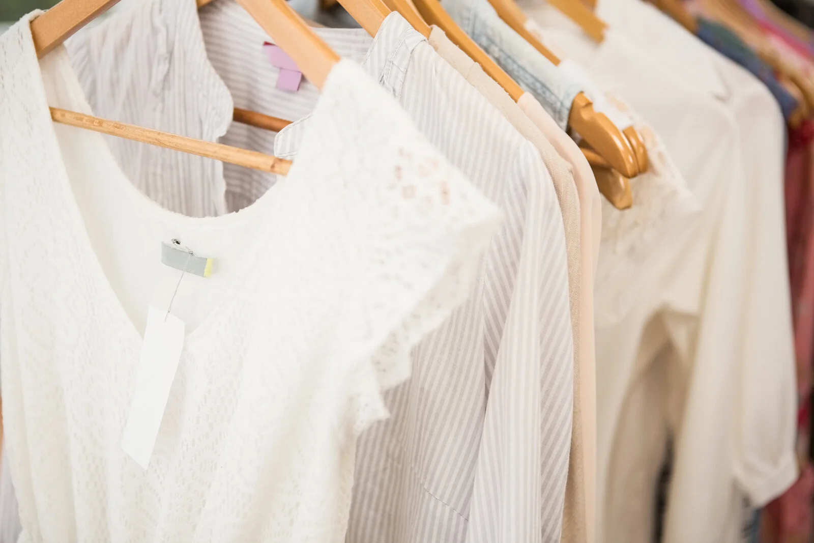 bigstock-Clothes-on-clothes-rail-in-clo-99157073.jpg