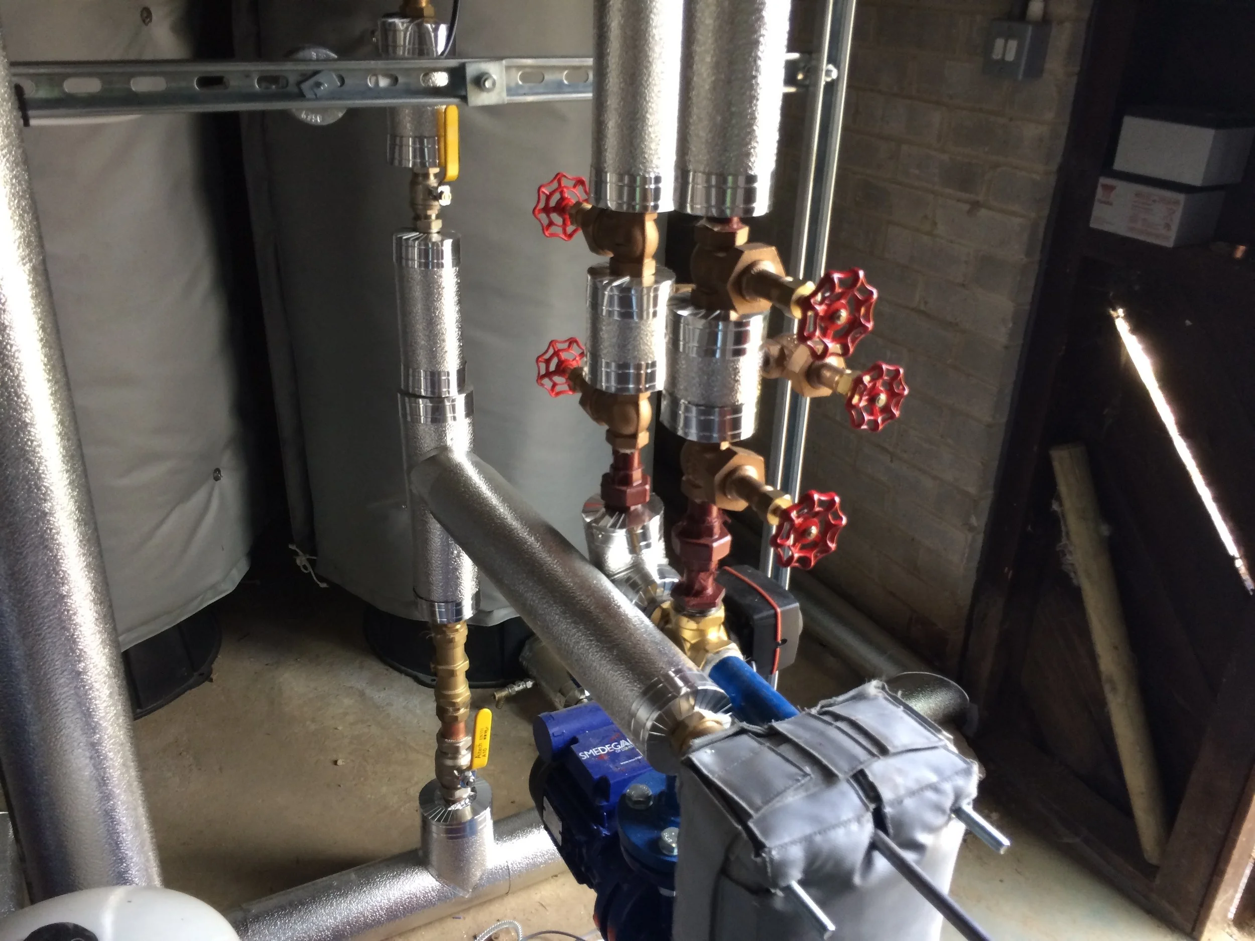 Stucco cladding to plantroom pipework 