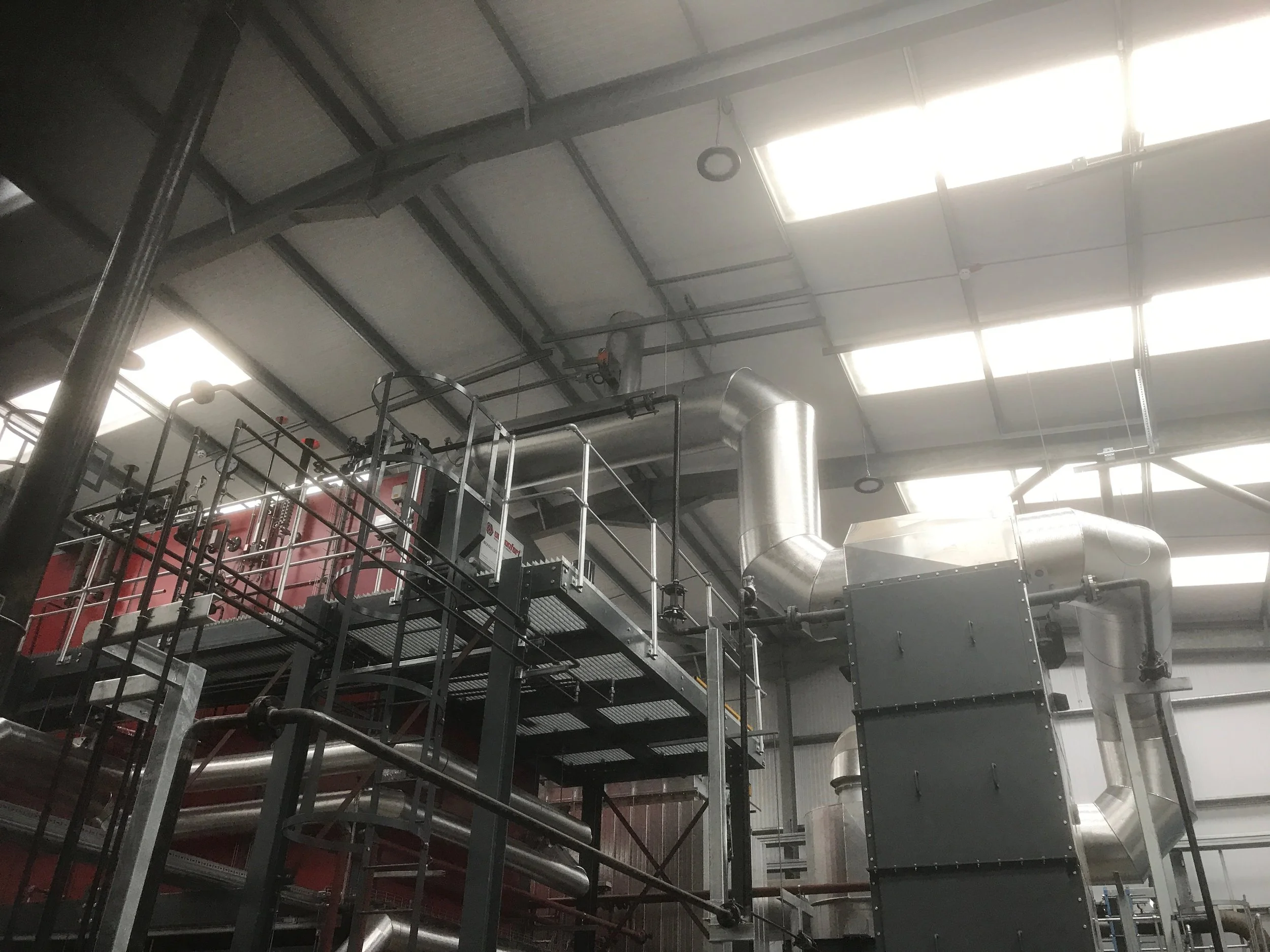 Stucco Ali cladding to generator flues