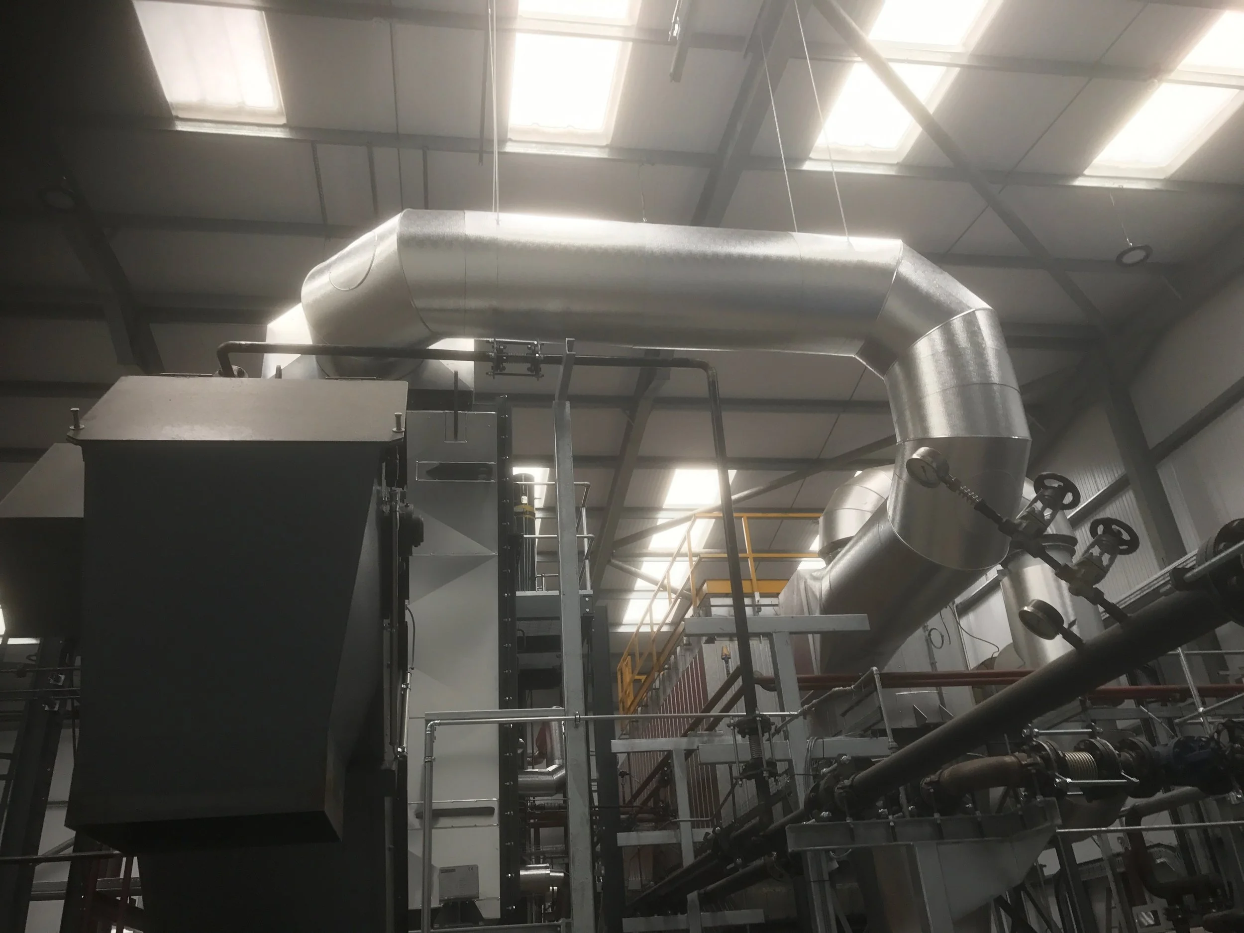 Stucco Ali cladding to generator flues