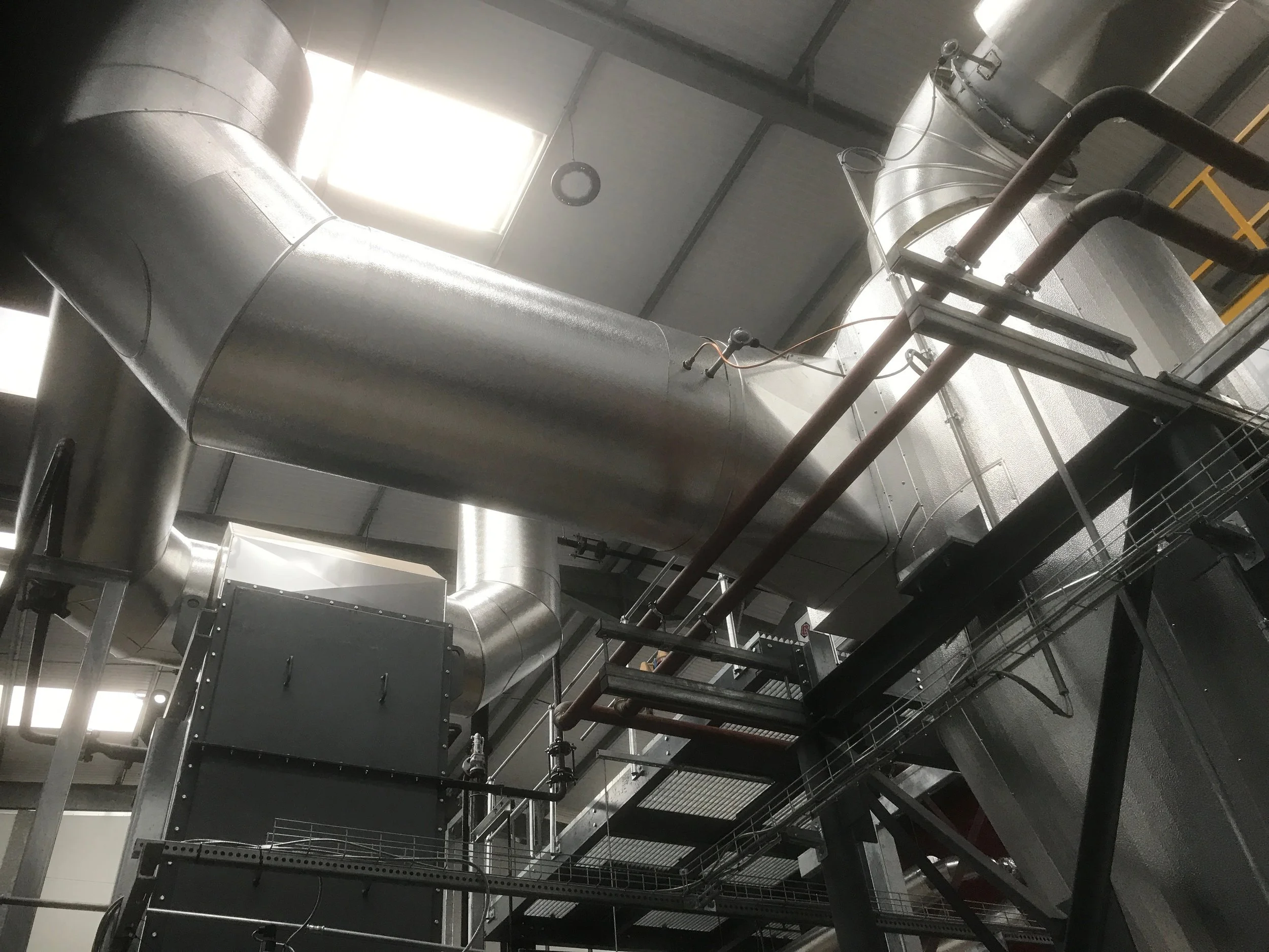 Stucco Ali cladding to generator flues