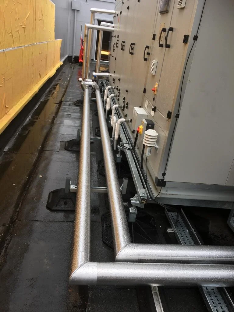 Stucco cladding to insulated pipework