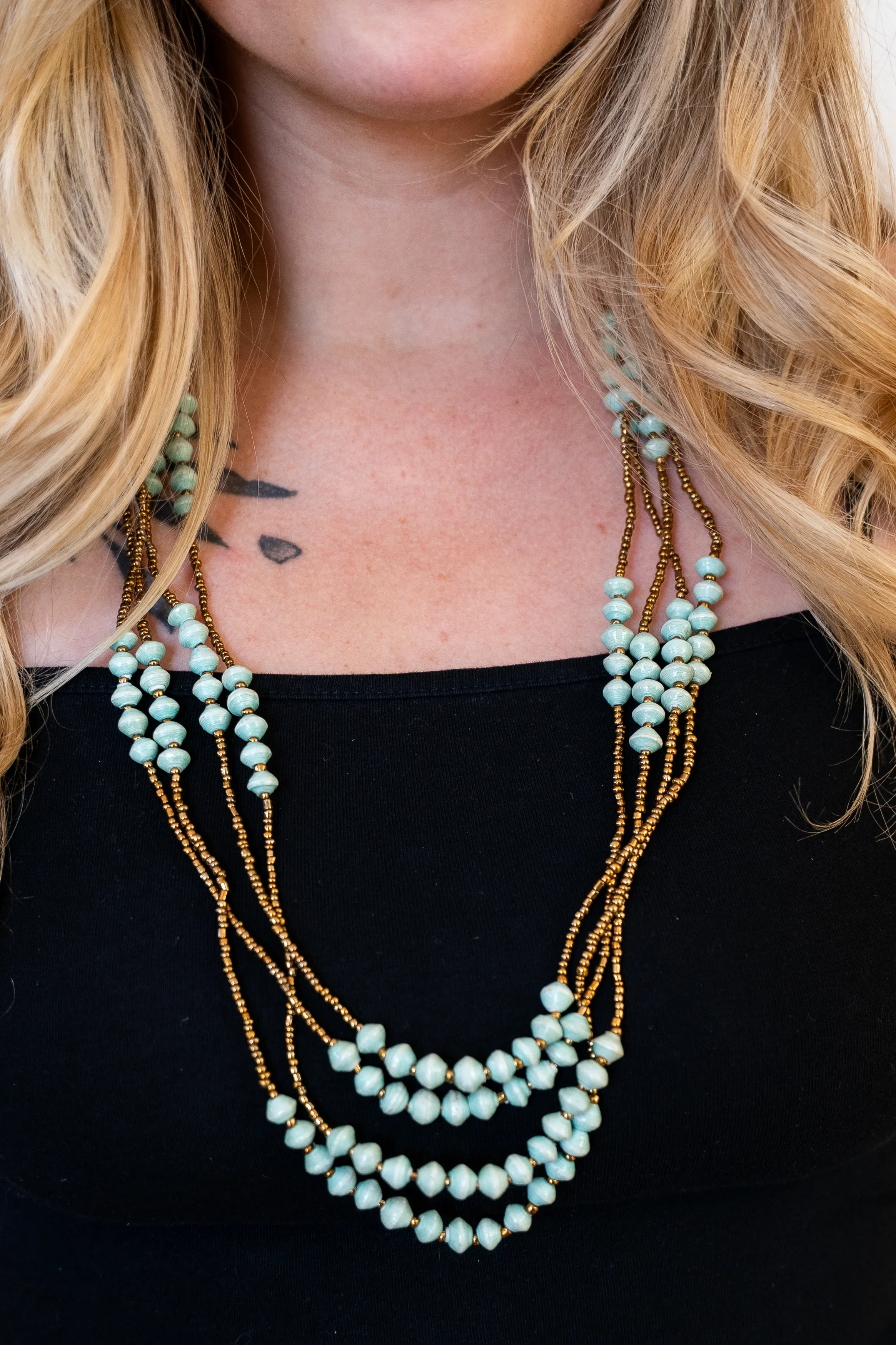 Mwebaza-Market-Four-Strand-Gold-Teal-Necklace-2.webp