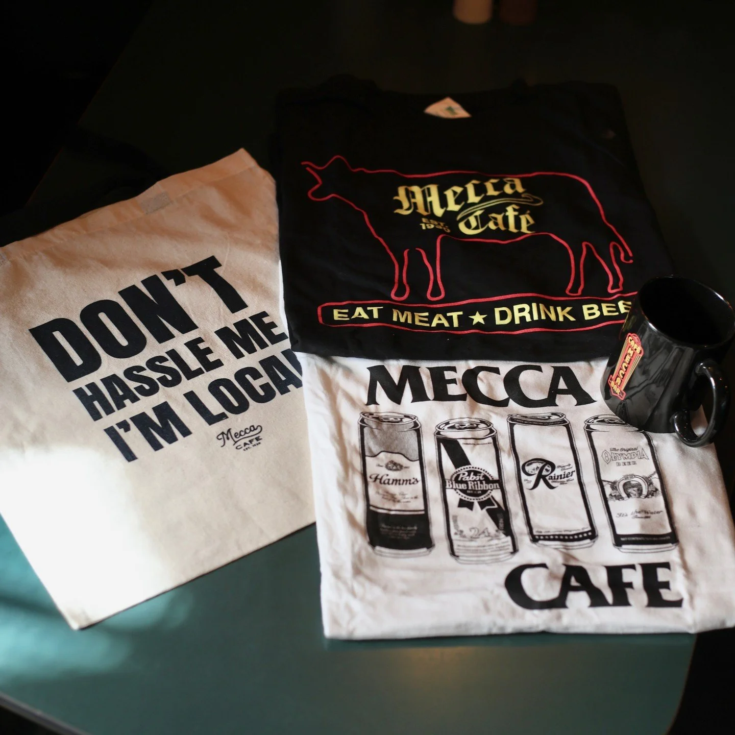 Brunch for you 🤝 Gifts for them. 

Tees, mugs, totes, stickers, hats - all created for those who prefer to wear the authentic stuff and skip the mass-produced "vintage" styles.

Take a piece of Mecca home with you, because memories are gre