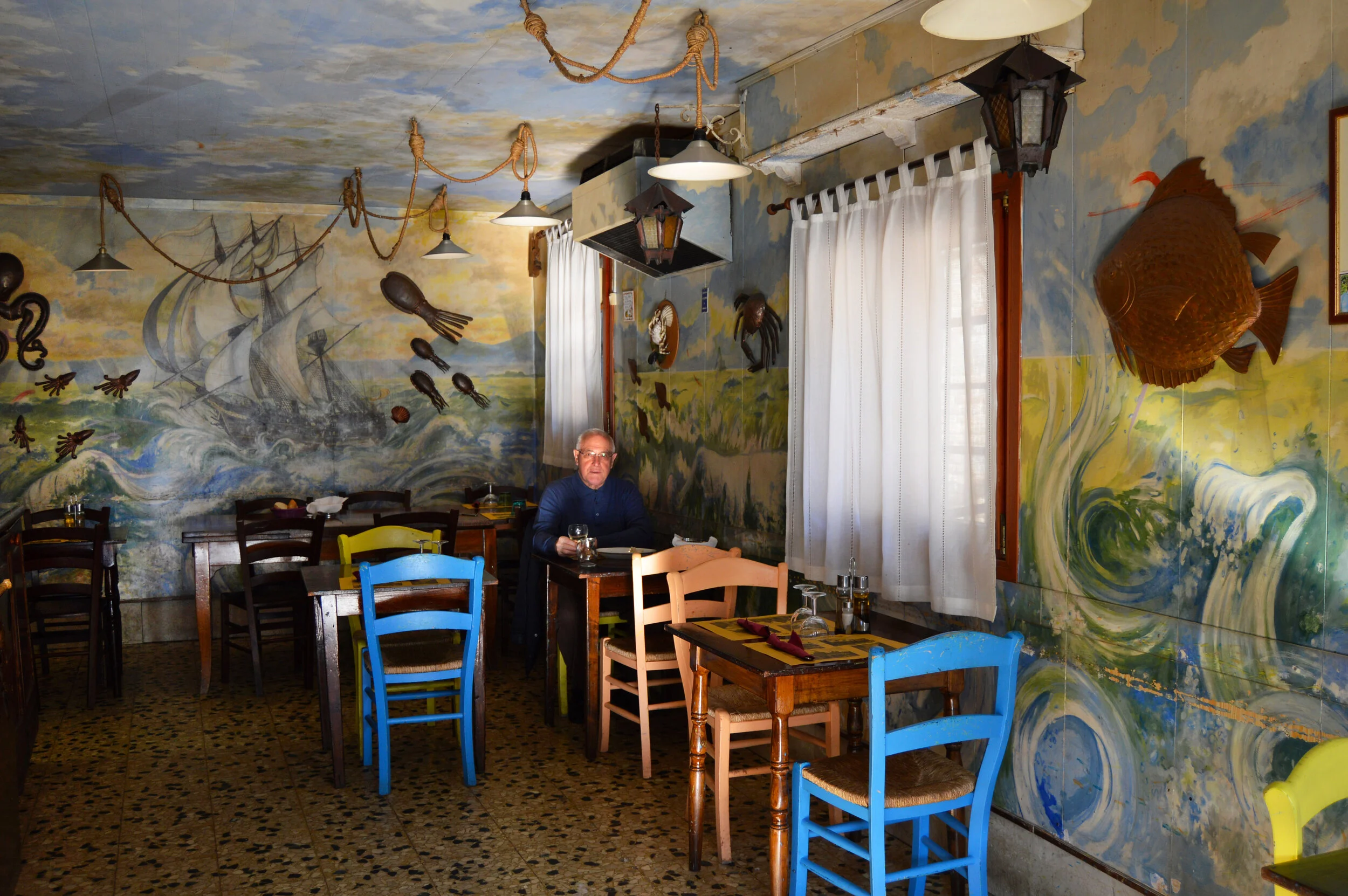  A Venice restaurant with lone diner. 