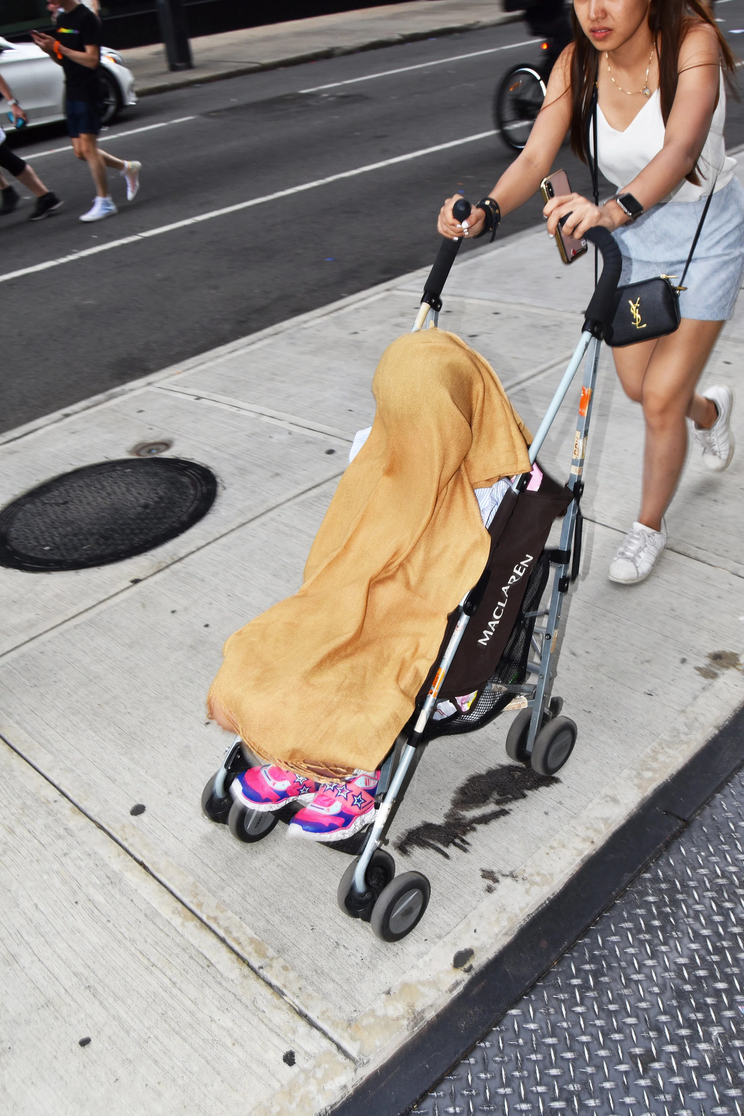  Covered child near the Pride Parade. 