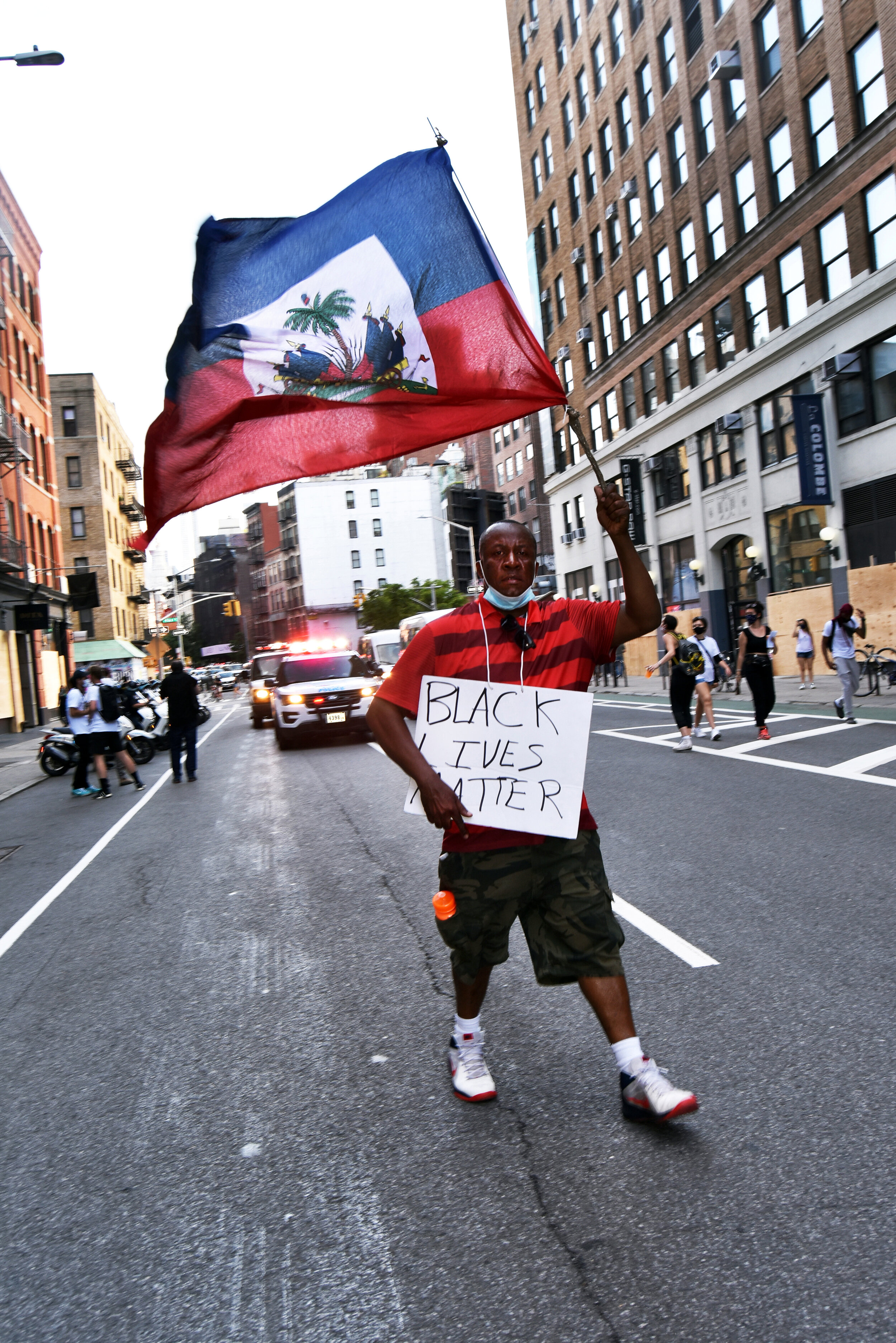  BLM protestor waving the flag of Haiti. 