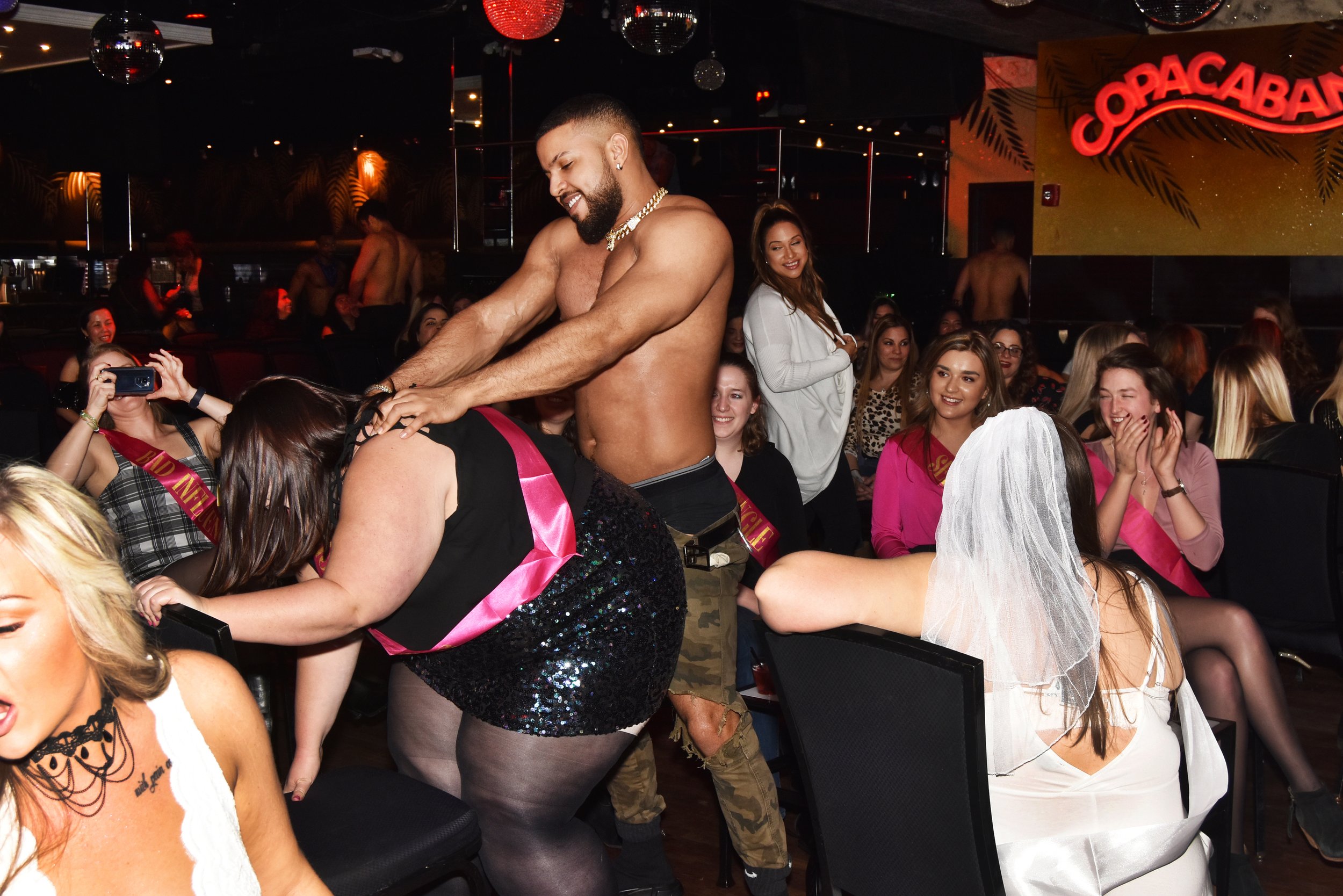 The Frantic Fun of Hunk-O-Mania, male strippers for women — Nina Roberts