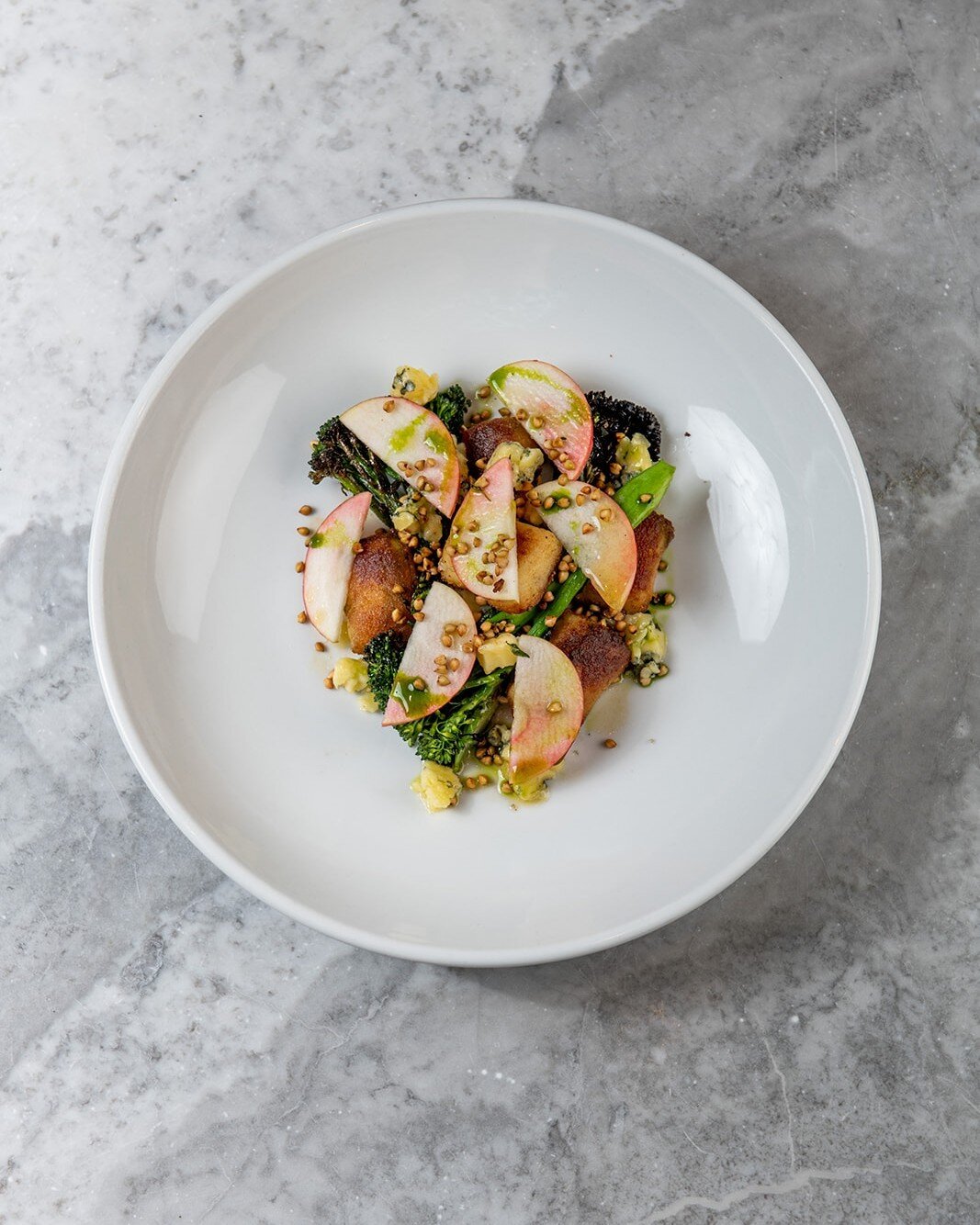 Our lunch menu&rsquo;s grilled broccoli dish is ideal for daytime dining at Kindling.⠀
⠀
Accompanied with @highwealddairy&rsquo;s Brighton Blue, baked potato gnocchi, and apple, it&rsquo;s flavourful, fresh, rich, and light all at once, and perfect w