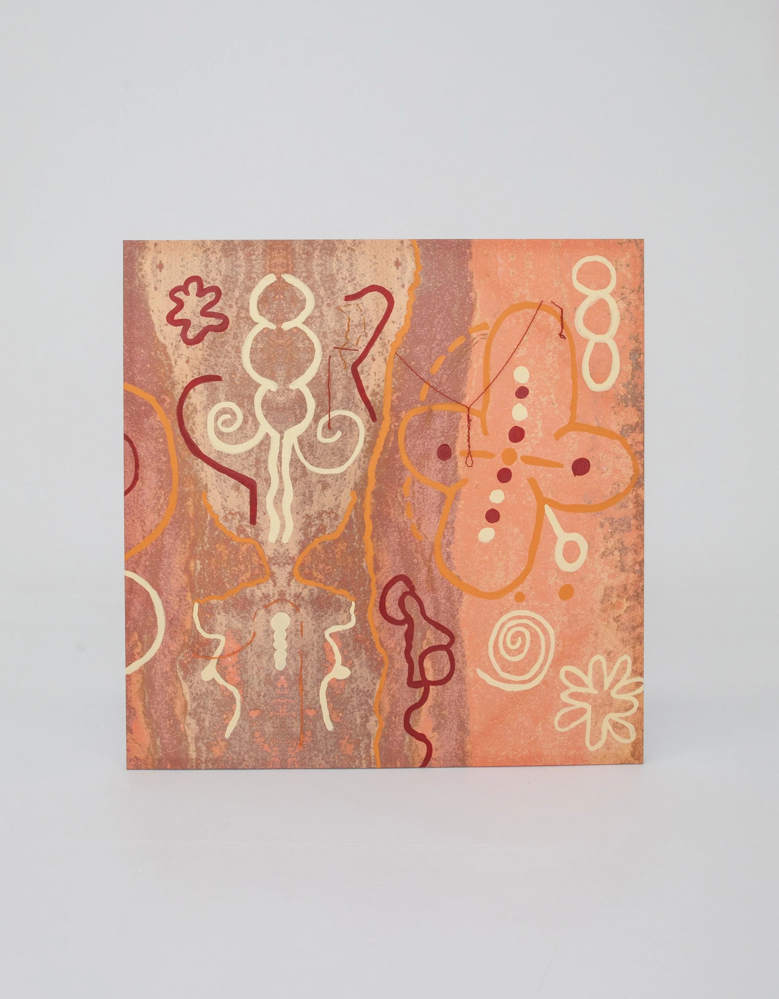 A rectangular piece of artwork with abstract designs and patterns in earthy tones including pink, orange, yellow, and maroon, featuring shapes resembling flowers, spirals, and lines on a textured background.