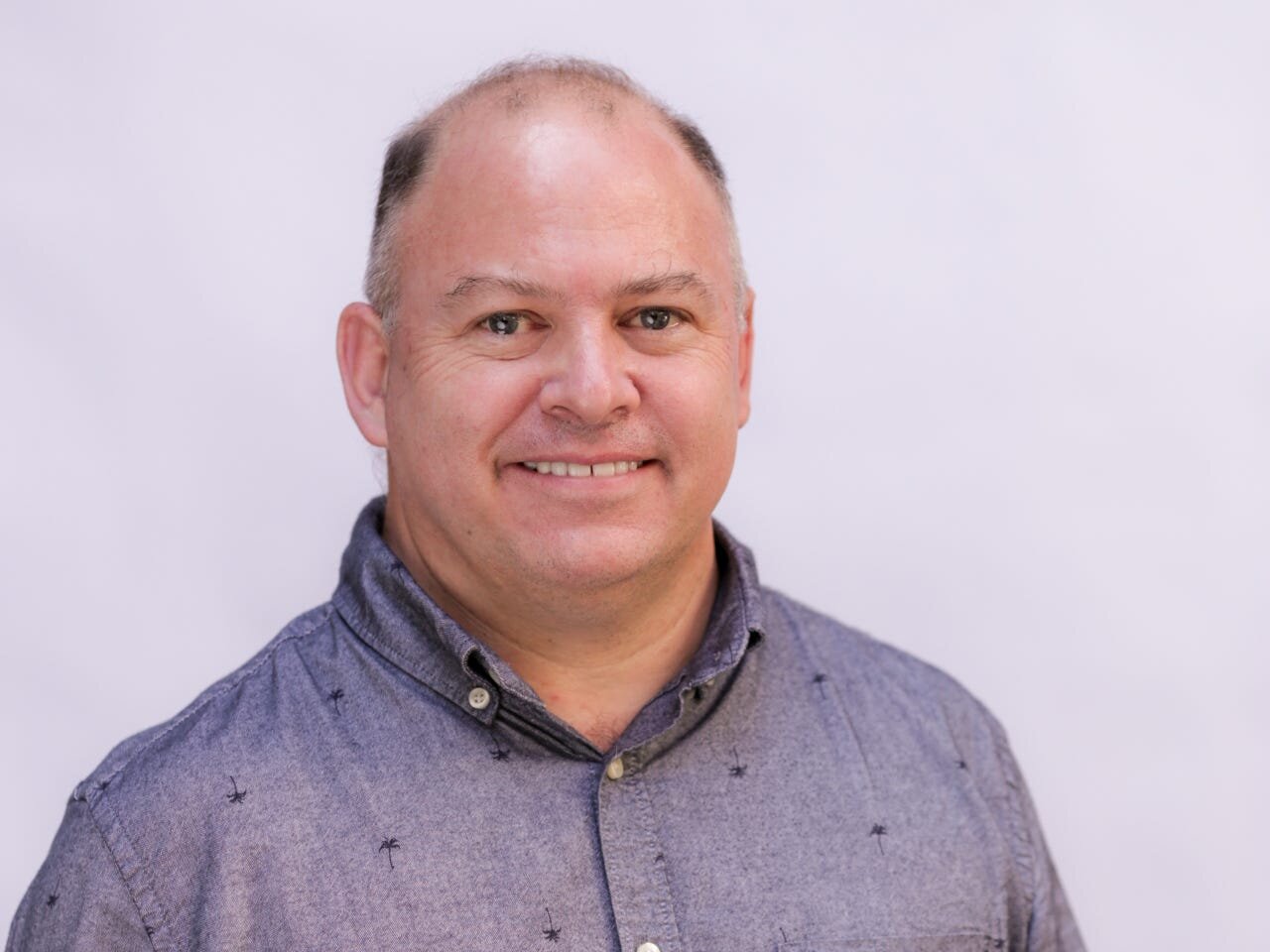 One of Tesla's first employees just took an electric-truck startup public in a $2 billion deal. Here's how he sold FedEx and UPS on his tech.