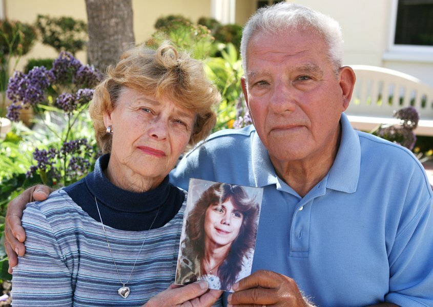 Lois and Arthur Serrin holding a picture of Jodine