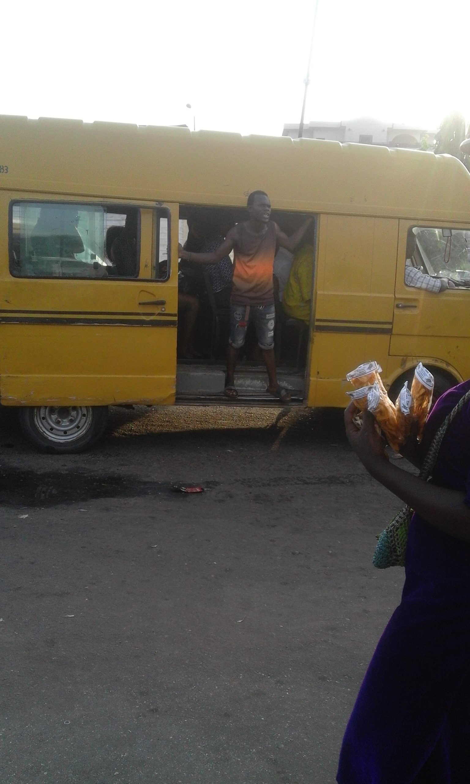 A_typical_danfo-bus_conductor-e1512546986984.jpg
