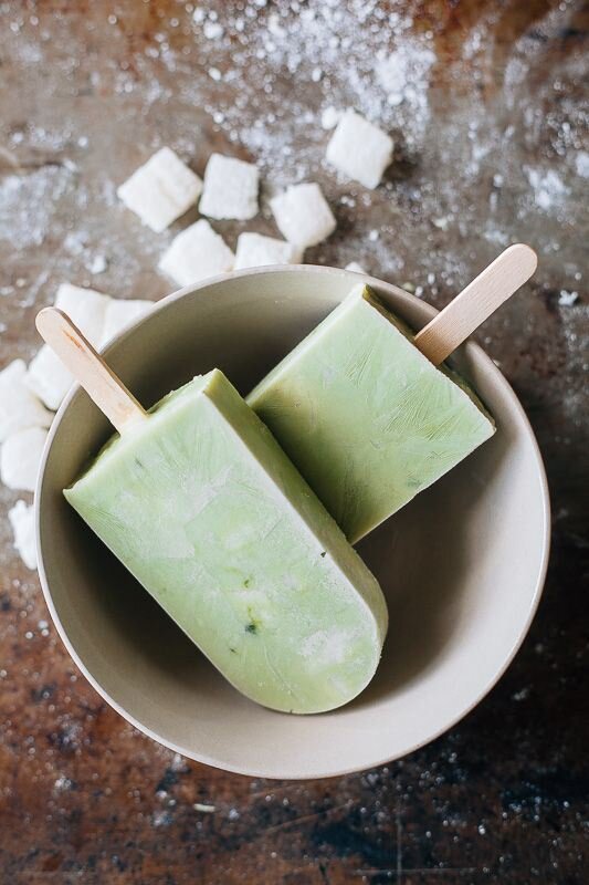 Two Matcha Mochi Yogurt Pops stacked in a bowl