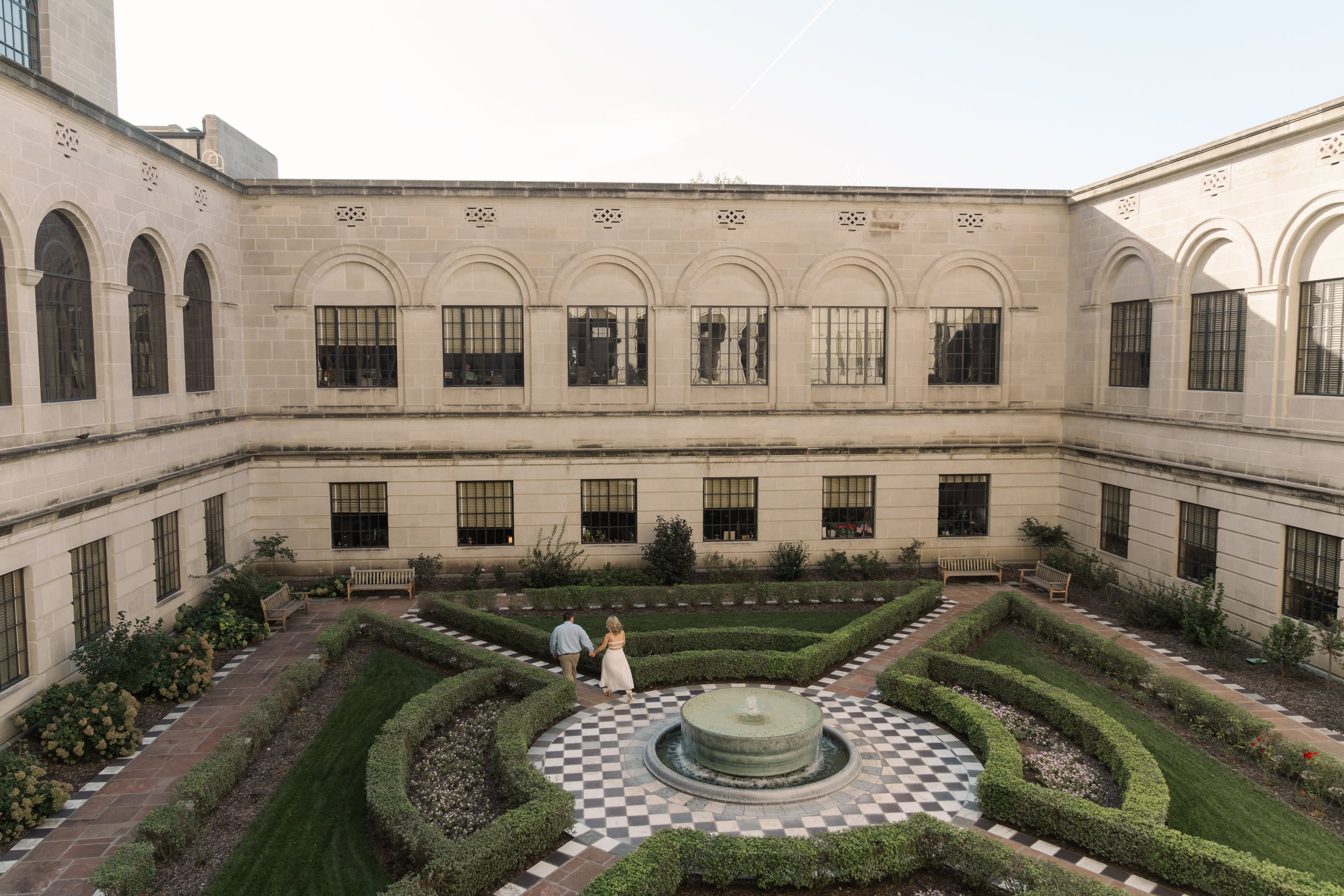 Engagement photoshoot in the garden of the Nebraska State Capitol in the fall