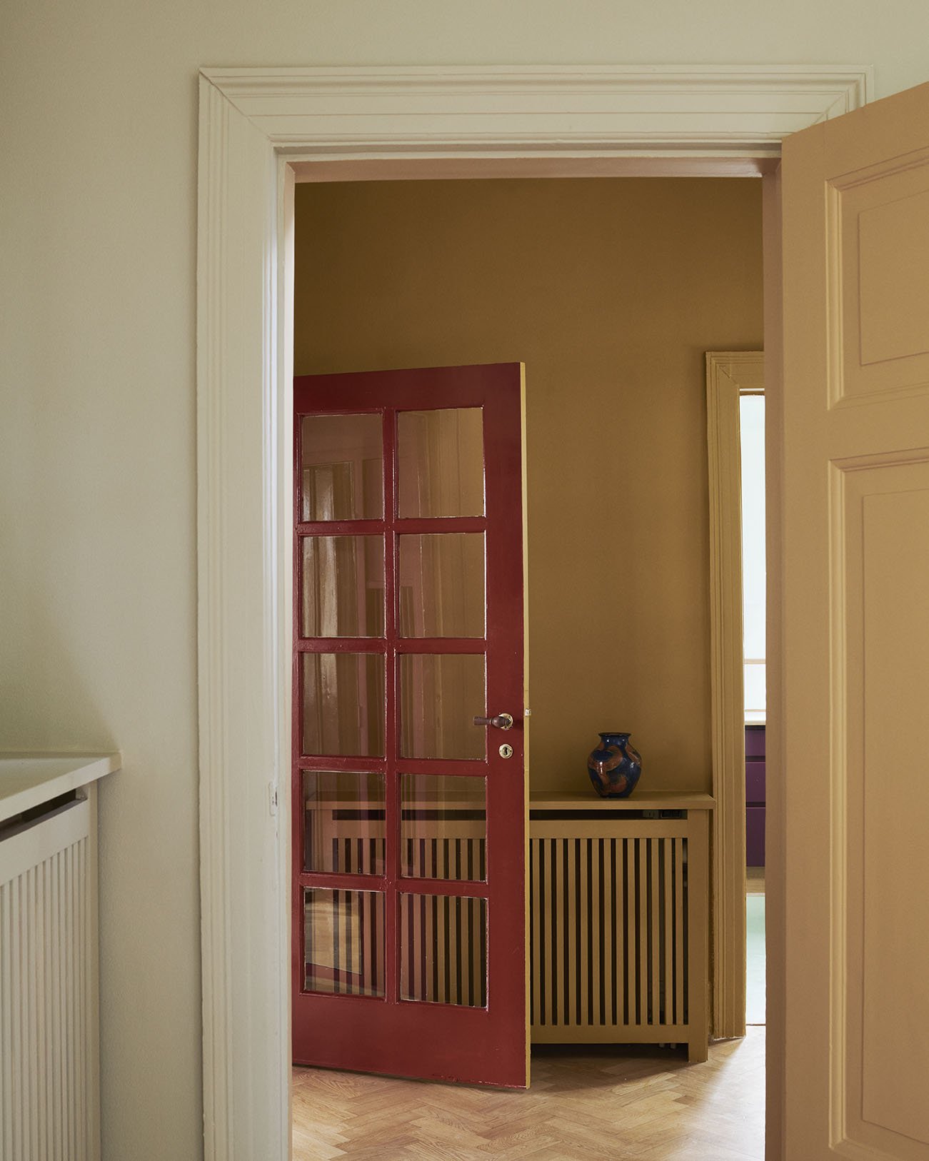 Wall and radiator painted with 'Mean Mustard'