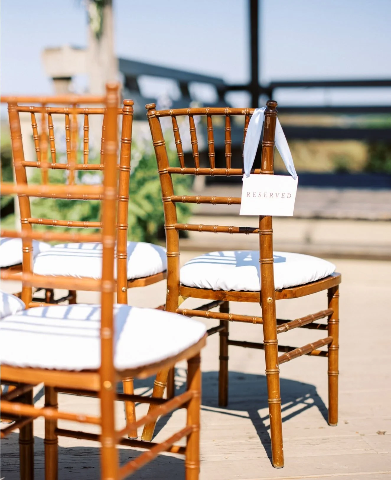 Reserved for the moments that matter most. Every seat tells a story and this one is waiting for someone who helped shape it. 
.
.
.
.
#coastalwedding #goldenisles #weddingdetails #villagecreeklanding