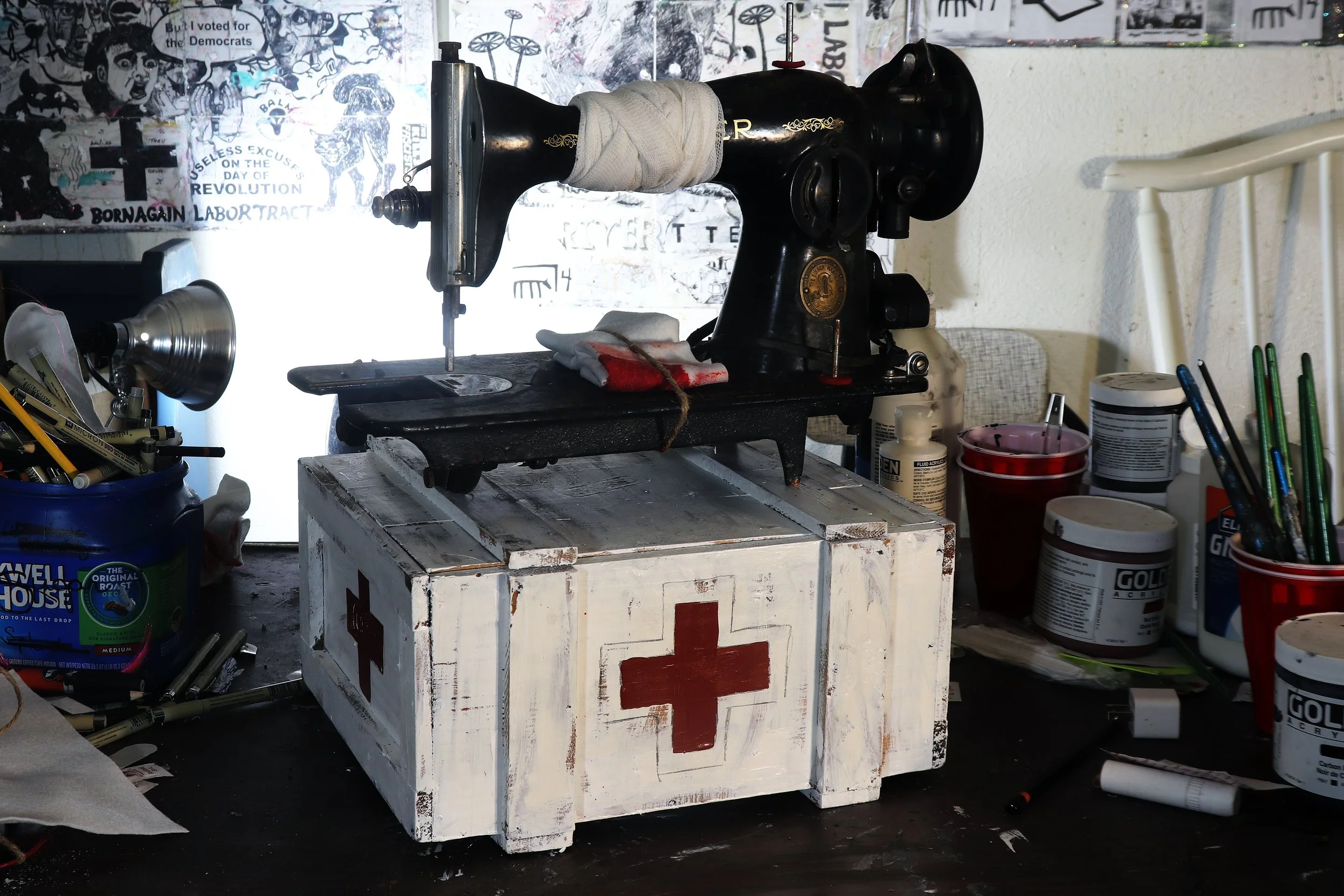 Women of the 19th of September (series) - salvaged sewing machine, bandages, felt, twine, stage blood, salvaged wood box, acrylic, graphite (2025)