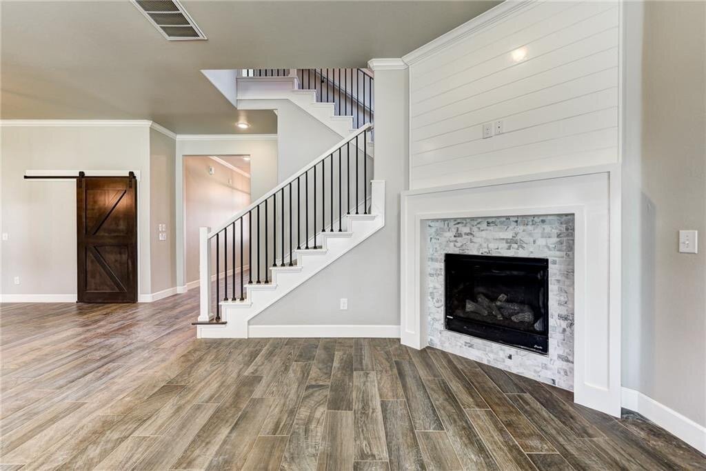 family room fireplace and stairs.JPG