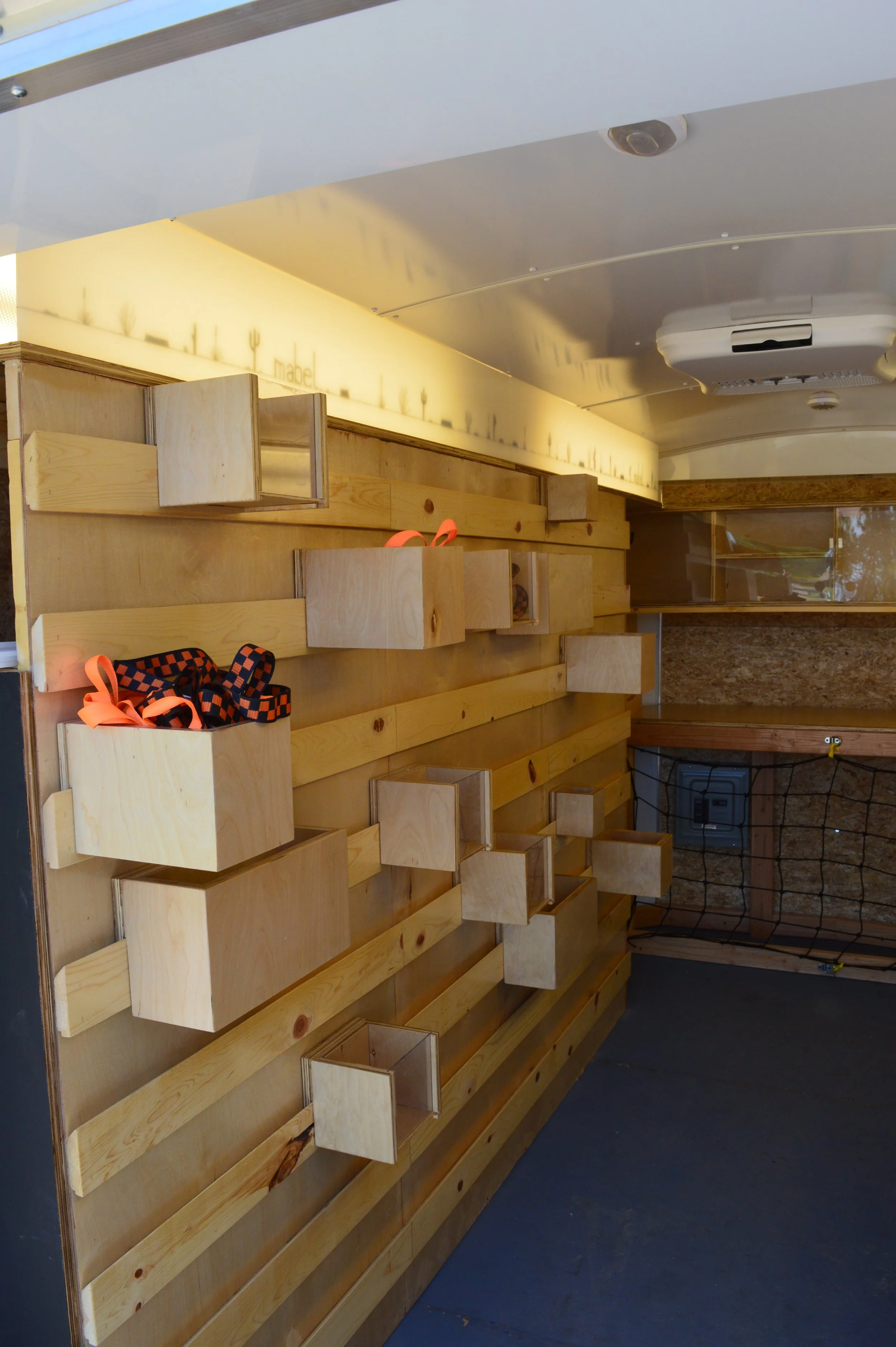  This wall features a french cleat system that allowed us to achieve the flexibility we wanted in the space. 