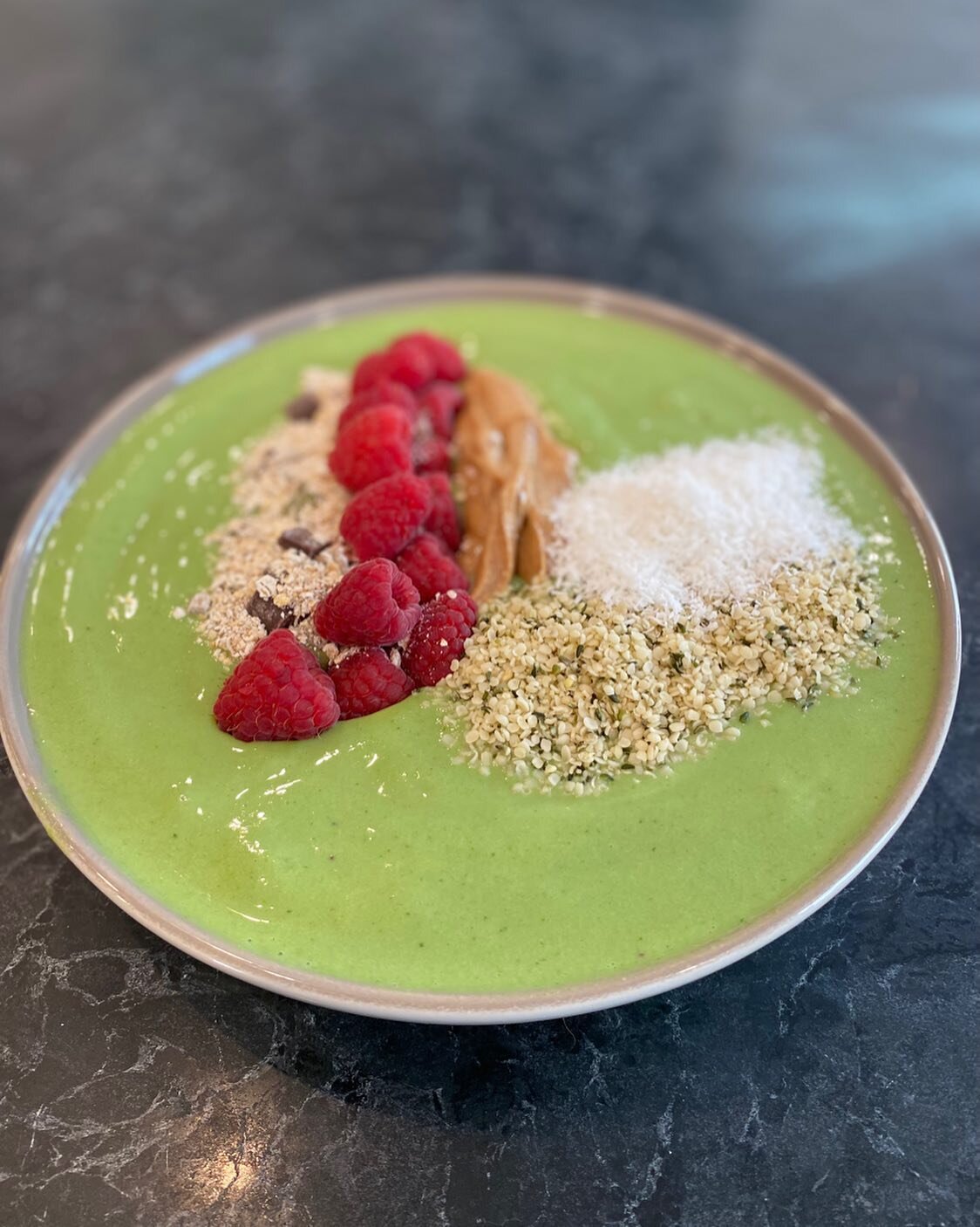 If it&rsquo;s thick enough to hold fruit then it&rsquo;s a smoothie bowl.
In blender : 3 frozen bananas, 1/2 cup mango, kale(to make it green), a heaping spoon of Greek yogurt a splash of milk of your choice and blend to the consistency of soft serve