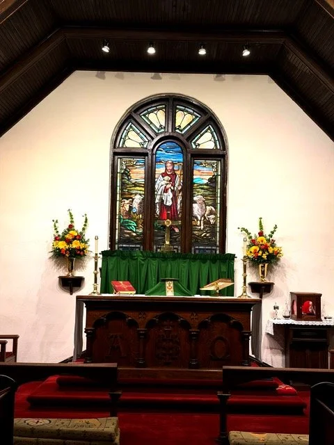 Altar with window portraying "Christ the Good Shepherd."