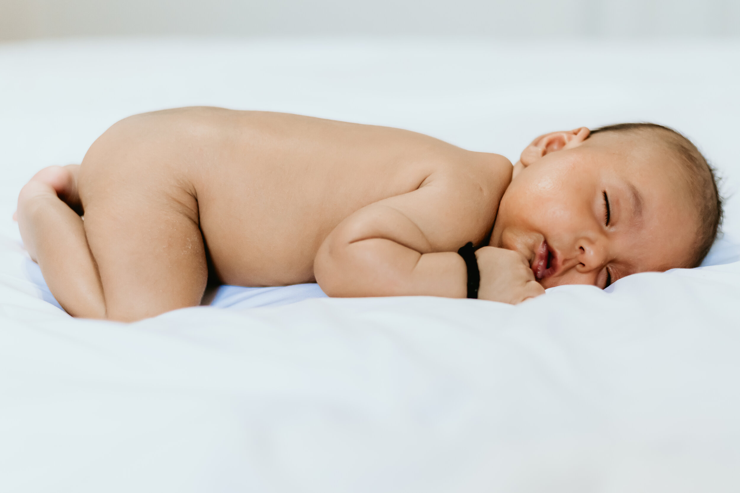  Connecticut Newborn Portrait - baby sleeping on the bed 