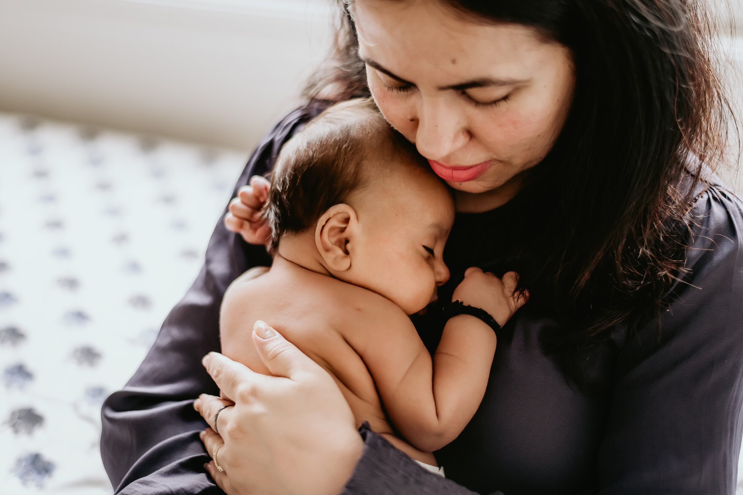  Connecticut Lifestyle Newborn Portrait - Mother holding her son on her chest 