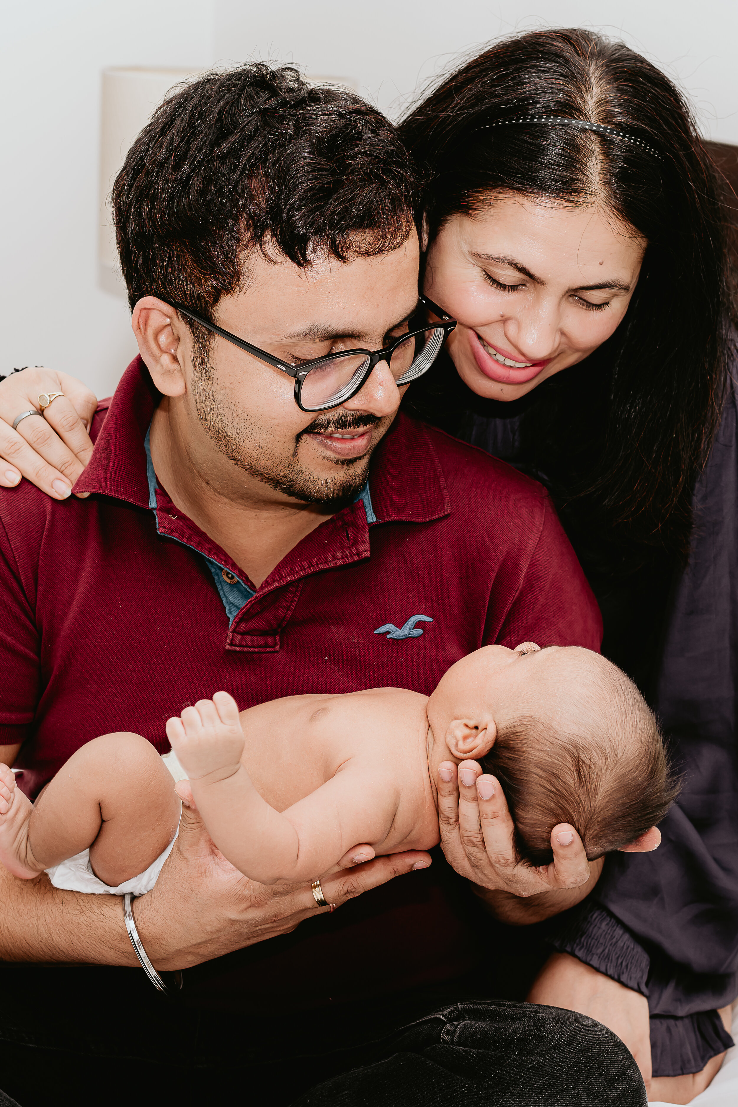  Connecticut Lifestyle Newborn Portrait - Mom and Dad holding son 