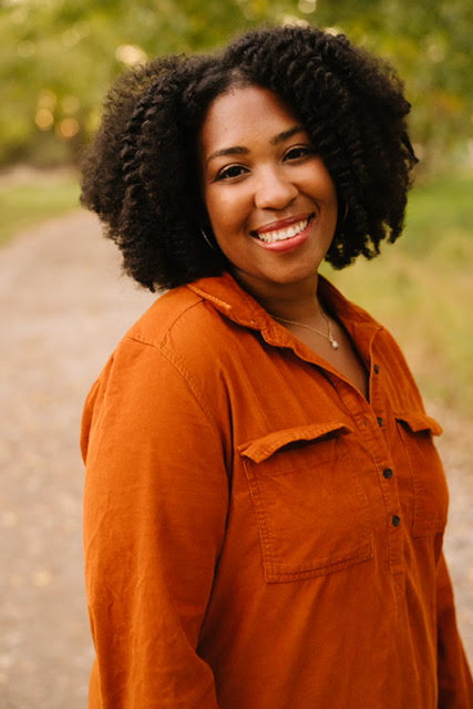 Amanda, postpartum doula at The Baby Hive, posing for professional brand photos.