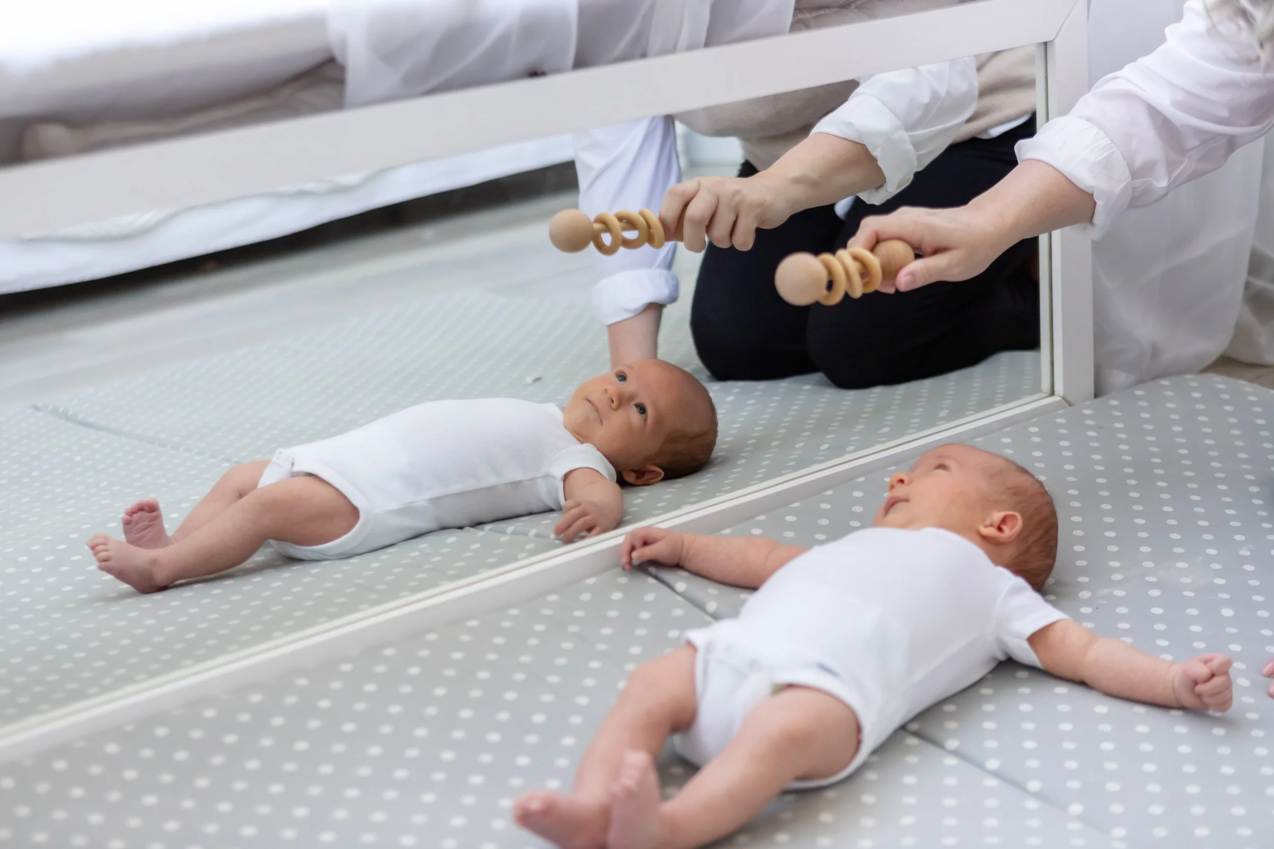 A postpartum doula, who specializes in newborn education, plays with a baby in Park City, Utah.