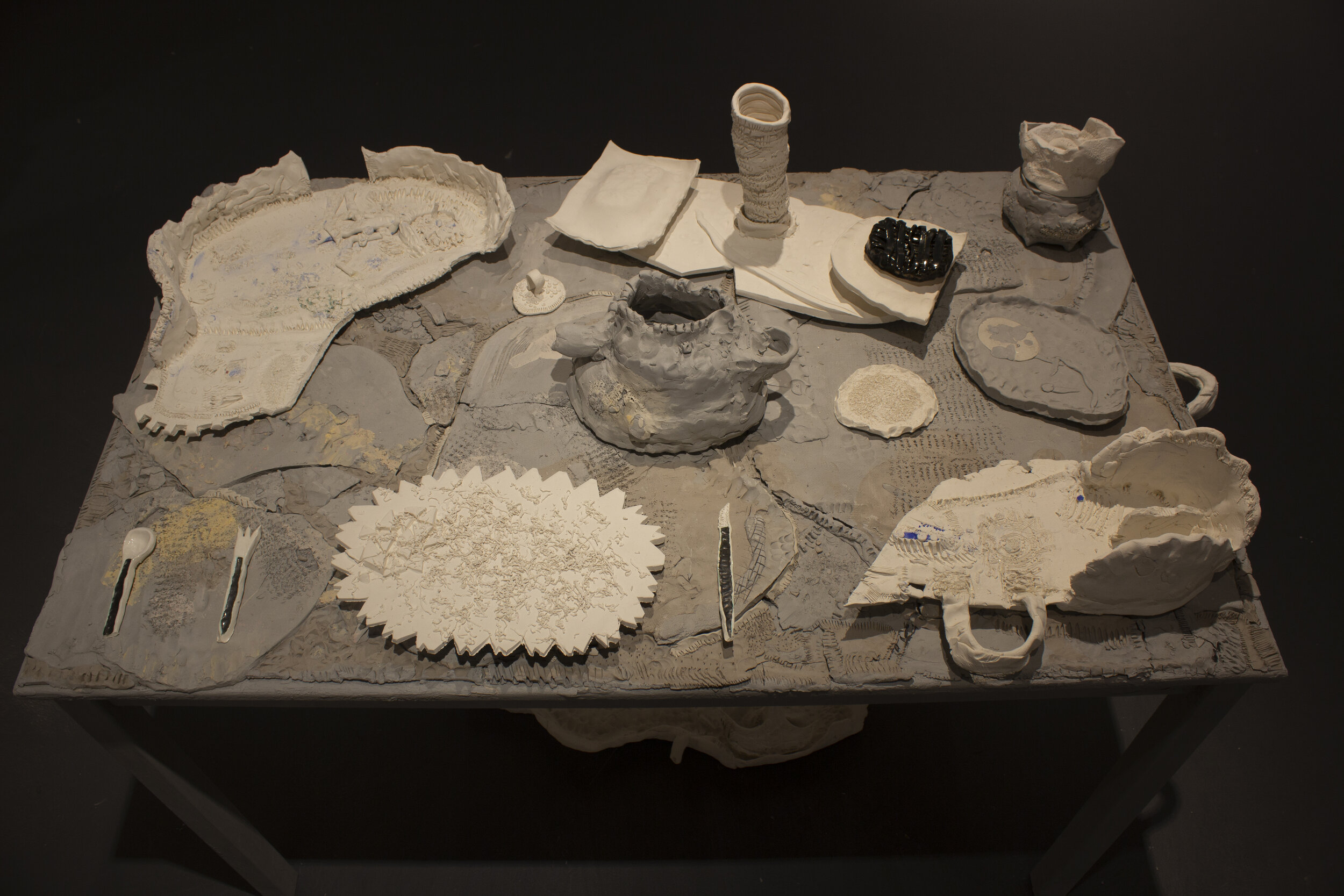    Tea Set    Wooden table, Earthenware slip, White slip, Earthenware clay, Paper porcelain clay, Stoneware clay, Colored pigment powder. 48x27.5 inches, 2019 