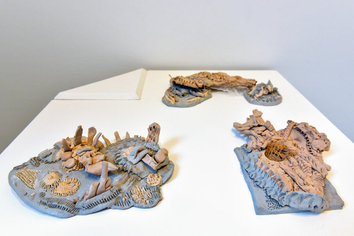    Slips through the gaps    Earthenware clay, paper porcelain clay, staples. Dimensions variable, 2019 