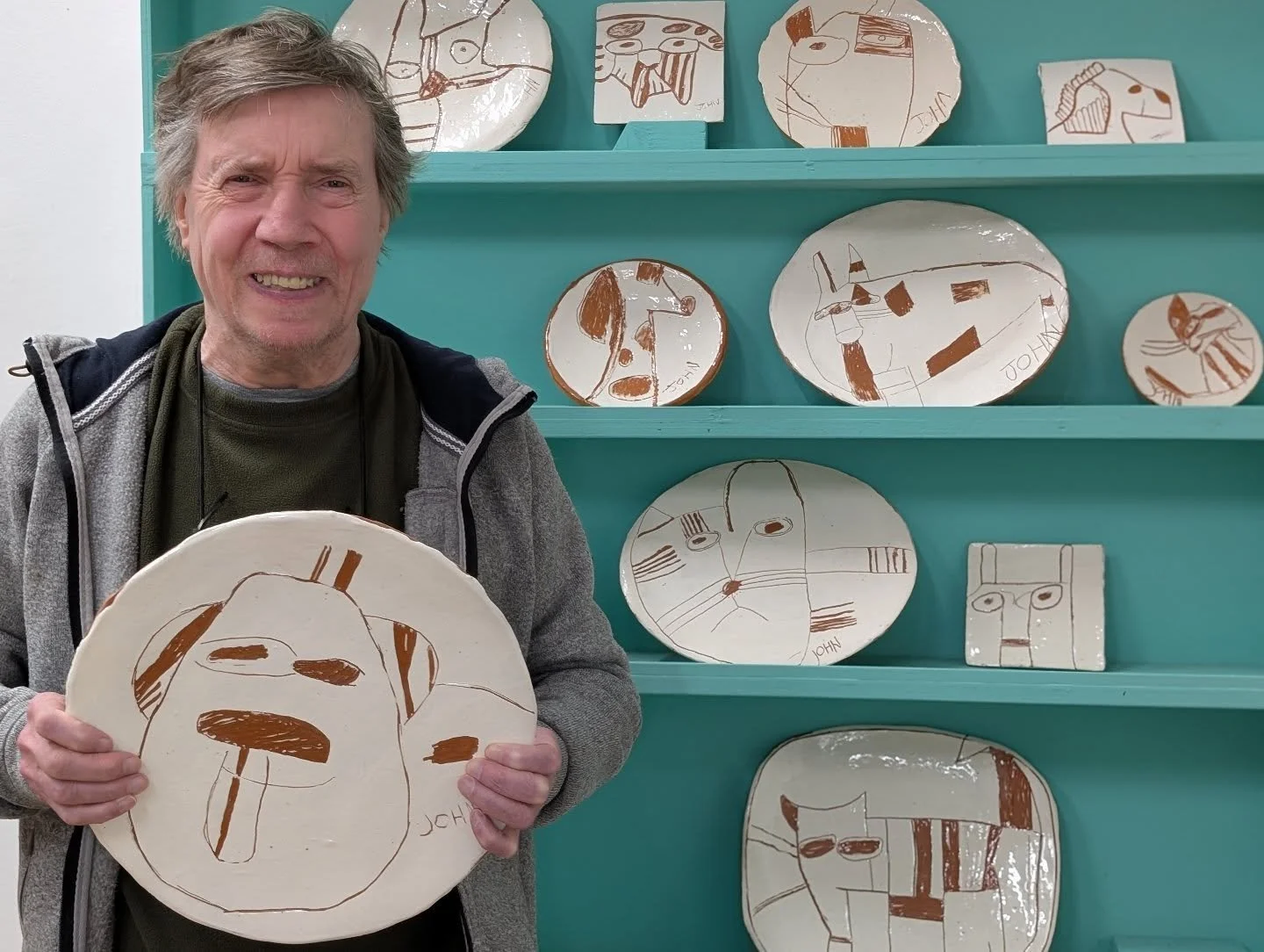"another dog, another day"

Dogs full of joy-on-legs, Cats acting like they own the place. John has such a knack for capturing character and these sgraffito terracotta plates are totally EXTRA.

We love the way John etches straight into the