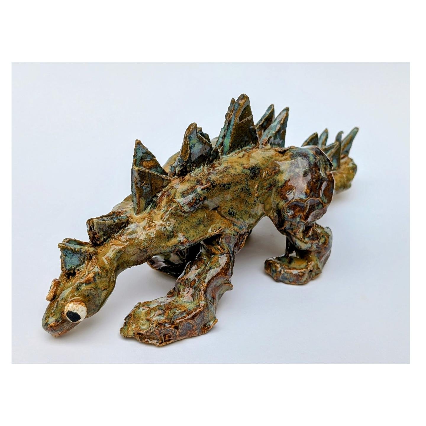 Meet Sam&rsquo;s chunky dinosaur 🦖 With its jungle-like glaze, you can almost hear it plodding through the undergrowth.

#ceramics
#handmadeceramic