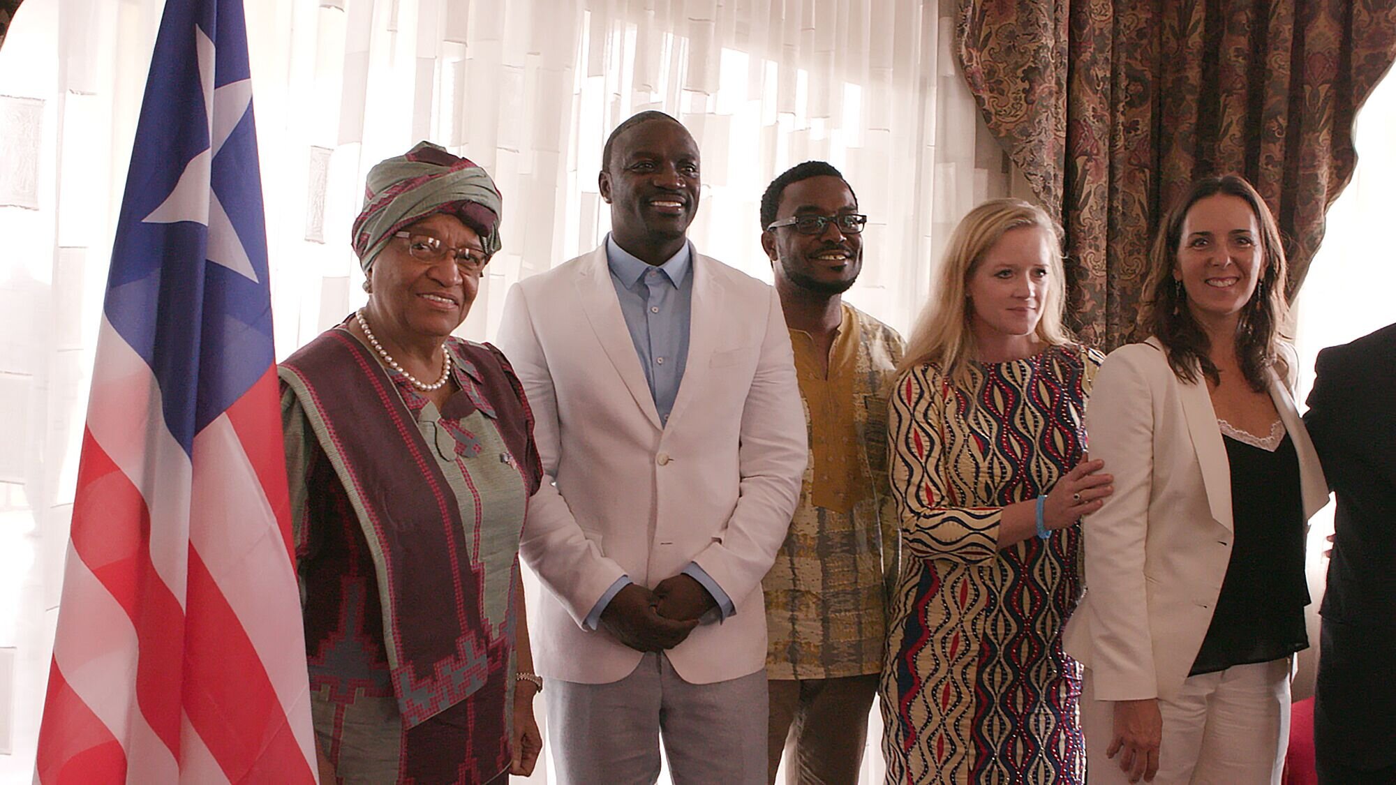 Akon and team and Pres Sirleaf.JPG