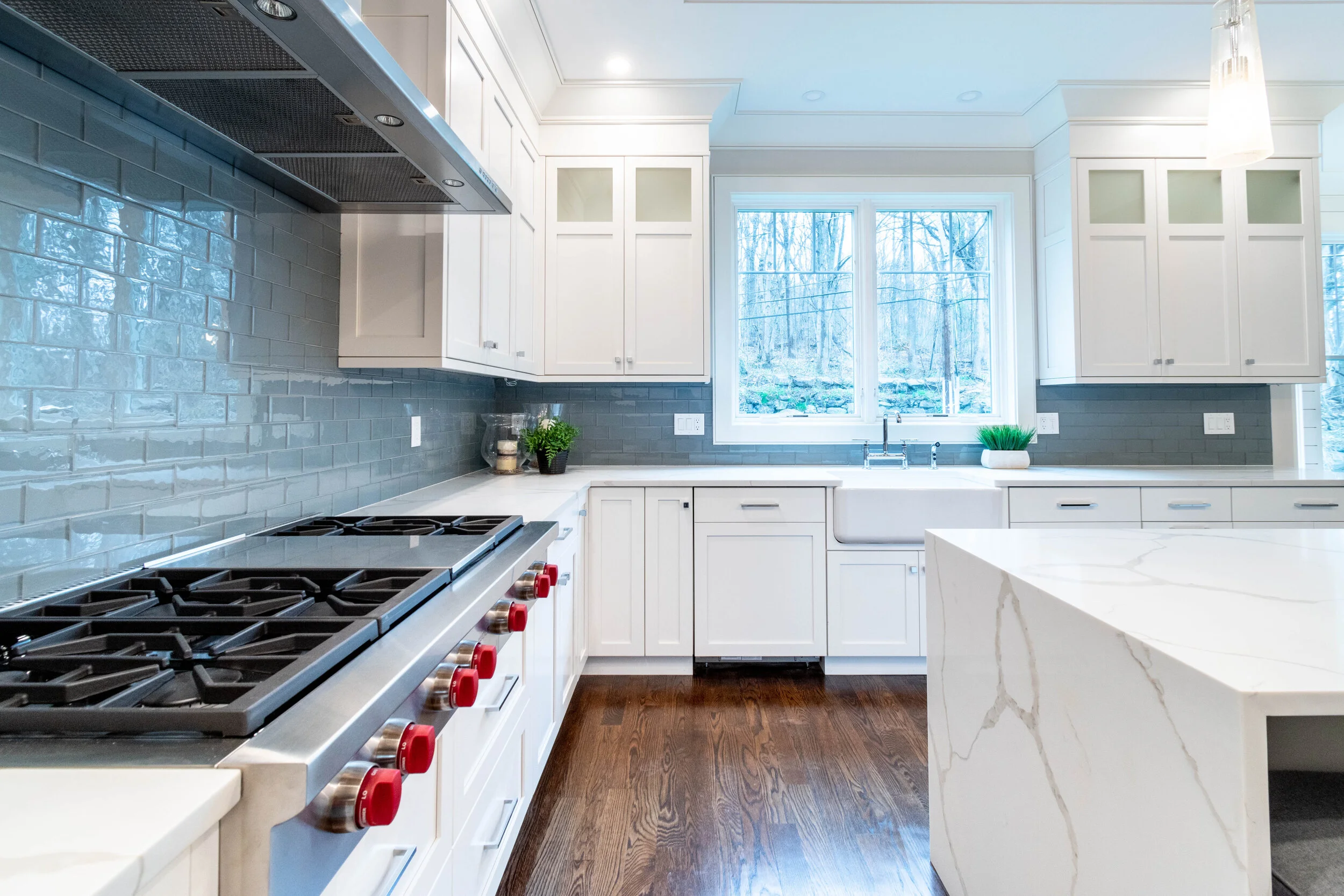 Material: Q-MSI Calacatta Classique (Bookmatched) Thickness, Finish & Stone Type: 3CM Polished Quartz Edge: Eased & Mitered Waterfall Leg Sink: Client - Farmer/Apron Sink