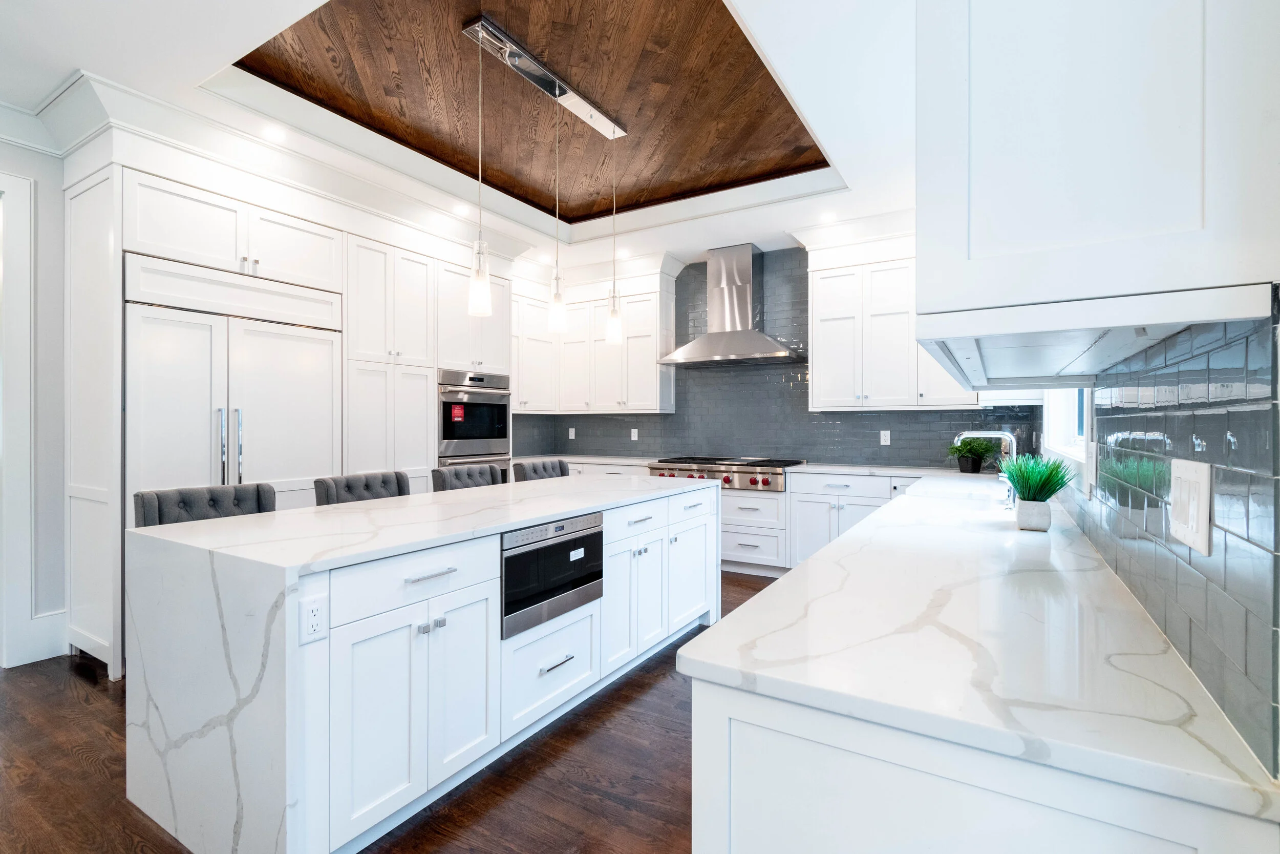 Material: Q-MSI Calacatta Classique (Bookmatched) Thickness, Finish & Stone Type: 3CM Polished Quartz Edge: Eased & Mitered Waterfall Leg Sink: Client - Farmer/Apron Sink