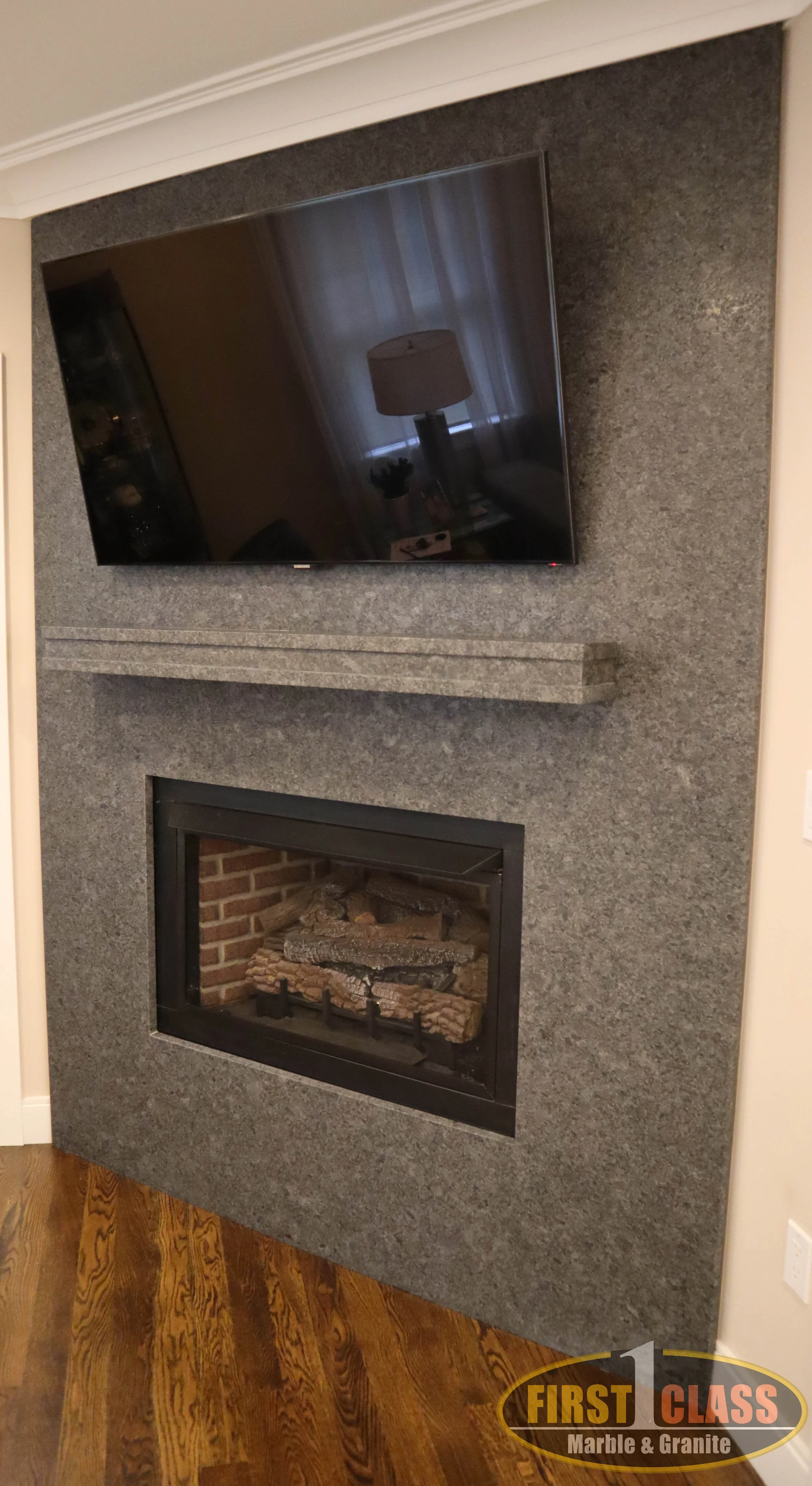 Material: Steel Grey Thickness, Finish & Stone Type: 3CM Leathered Granite Edge: TV Cutout - Eased Honed Fireplace cutout - Eased Leather Outside edge - 1/4 Bevel Leather Shelf - Eased Leather