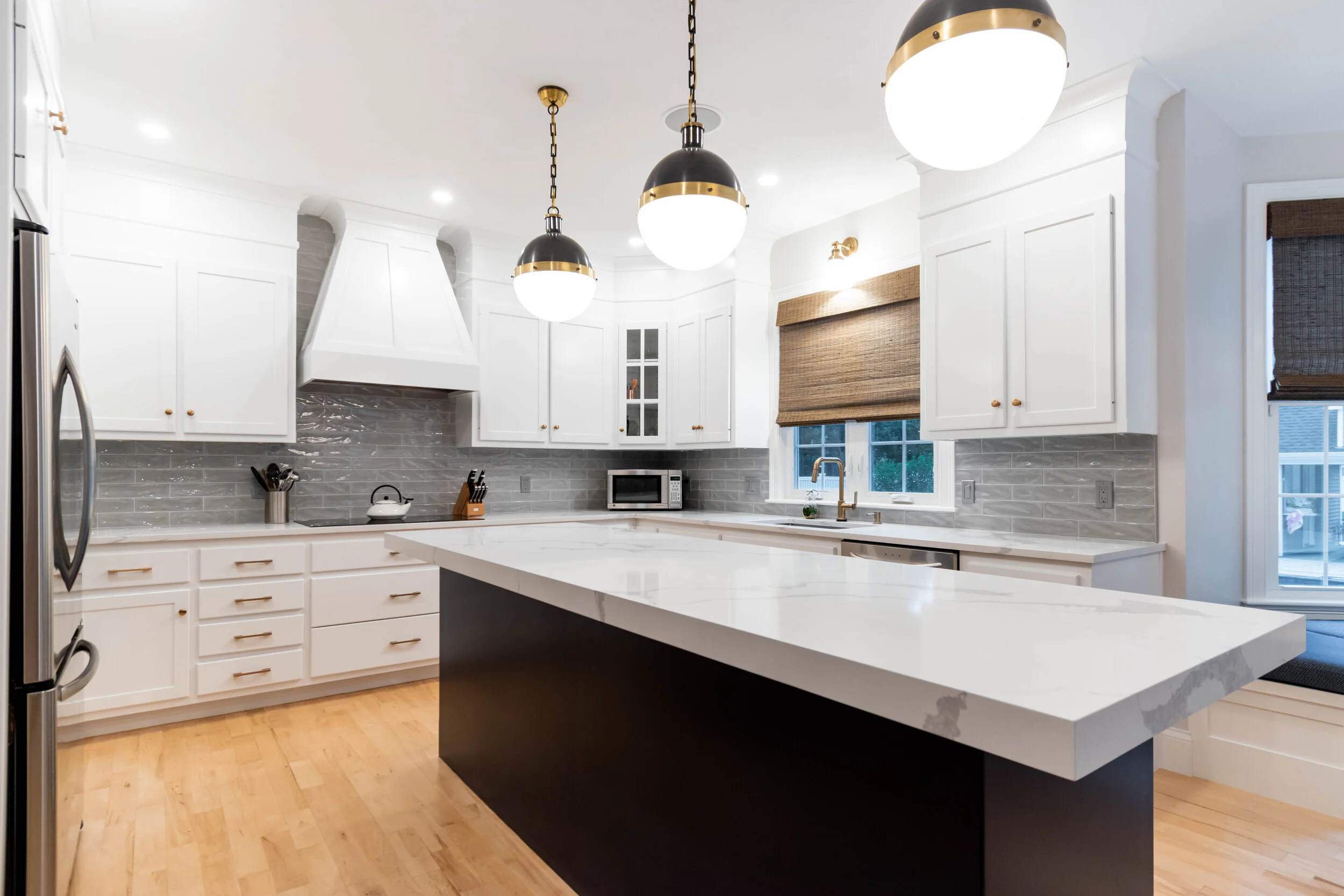 Material: IndoQuartz Calacatta Venice Thickness, Finish & Stone Type: 3CM Polished Quartz Edge: Perimeter Counters = Eased edge Island = 2 1/2" miter Sink: Client’s sink: Under-Mount