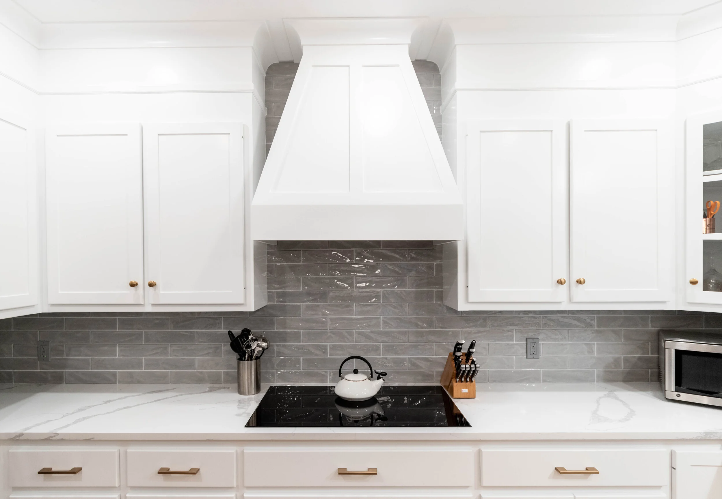 Material: IndoQuartz Calacatta Venice Thickness, Finish & Stone Type: 3CM Polished Quartz Edge: Perimeter Counters = Eased edge Island = 2 1/2" miter Sink: Client’s sink: Under-Mount