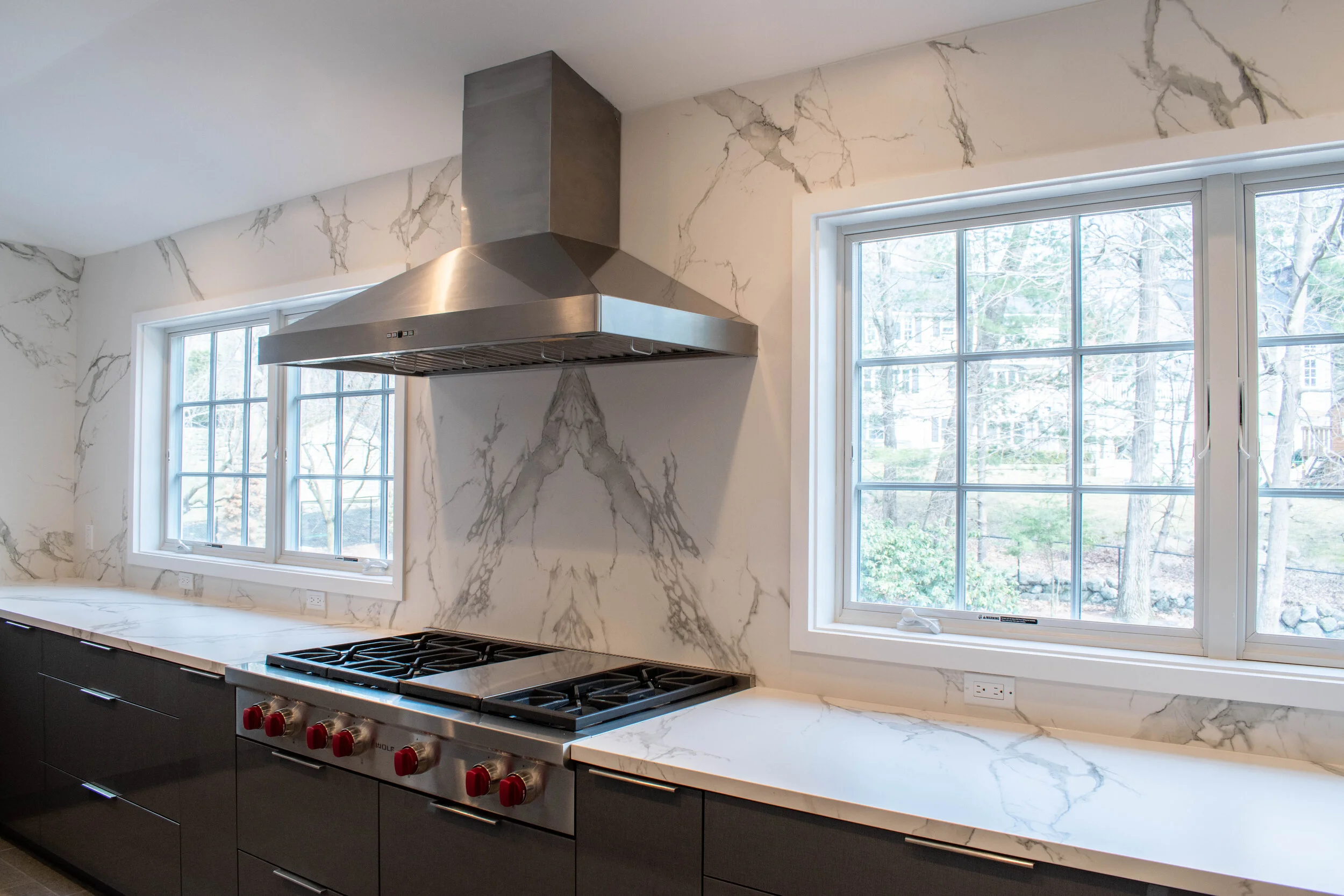Material: Dekton Aura 15 (Bookmatched) Thickness, Finish & Stone Type: 2CM Polished Dekton Edge: Main Counter - 1 1/4" Miter Island - 2" Mitered / Waterfall Leg