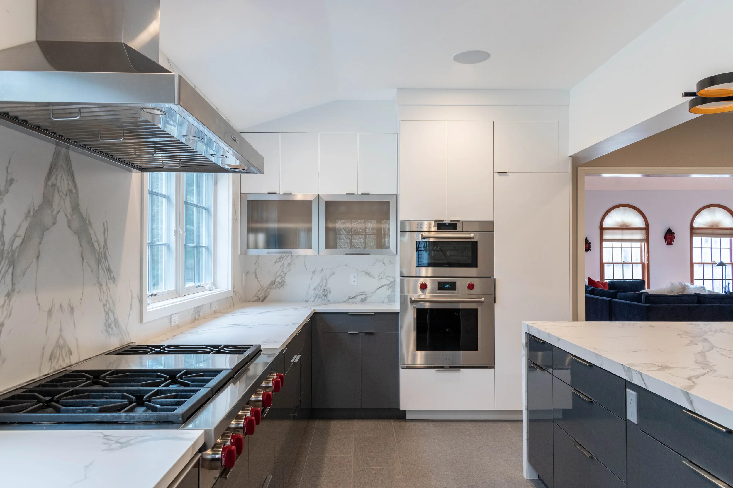 Material: Dekton Aura 15 (Bookmatched) Thickness, Finish & Stone Type: 2CM Polished Dekton Edge: Main Counter - 1 1/4" Miter Island - 2" Mitered / Waterfall Leg