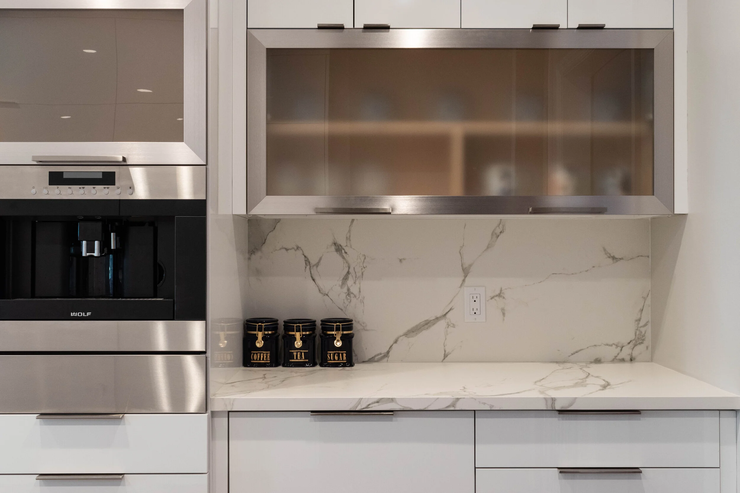Material: Dekton Aura 15 (Bookmatched) Thickness, Finish & Stone Type: 2CM Polished Dekton Edge: Main Counter - 1 1/4" Miter Island - 2" Mitered / Waterfall Leg