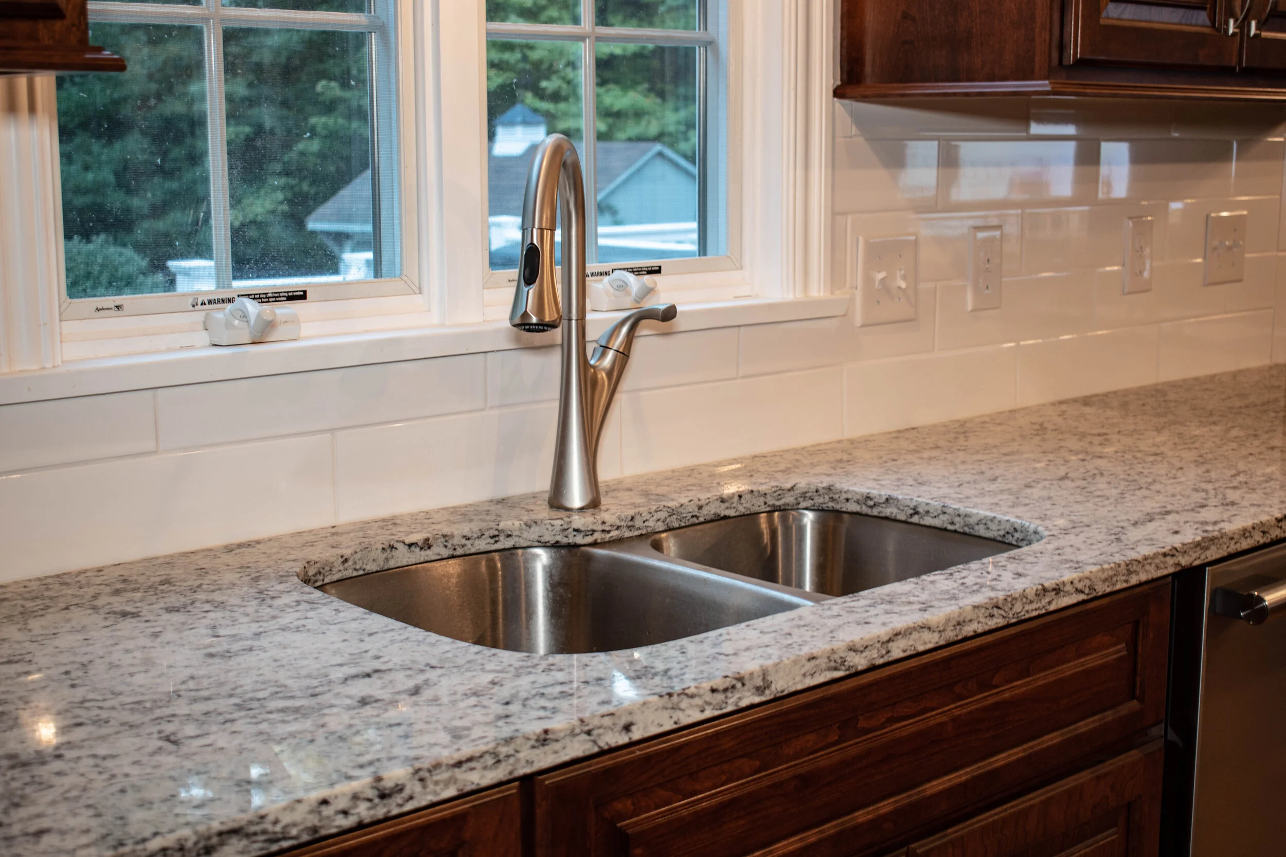 Material: SF / White Ornamental Thickness, Finish & Stone Type: 3CM Polished Granite Edge: Main Counters: Eased Island: Waterfall Sink: KB18-SP4